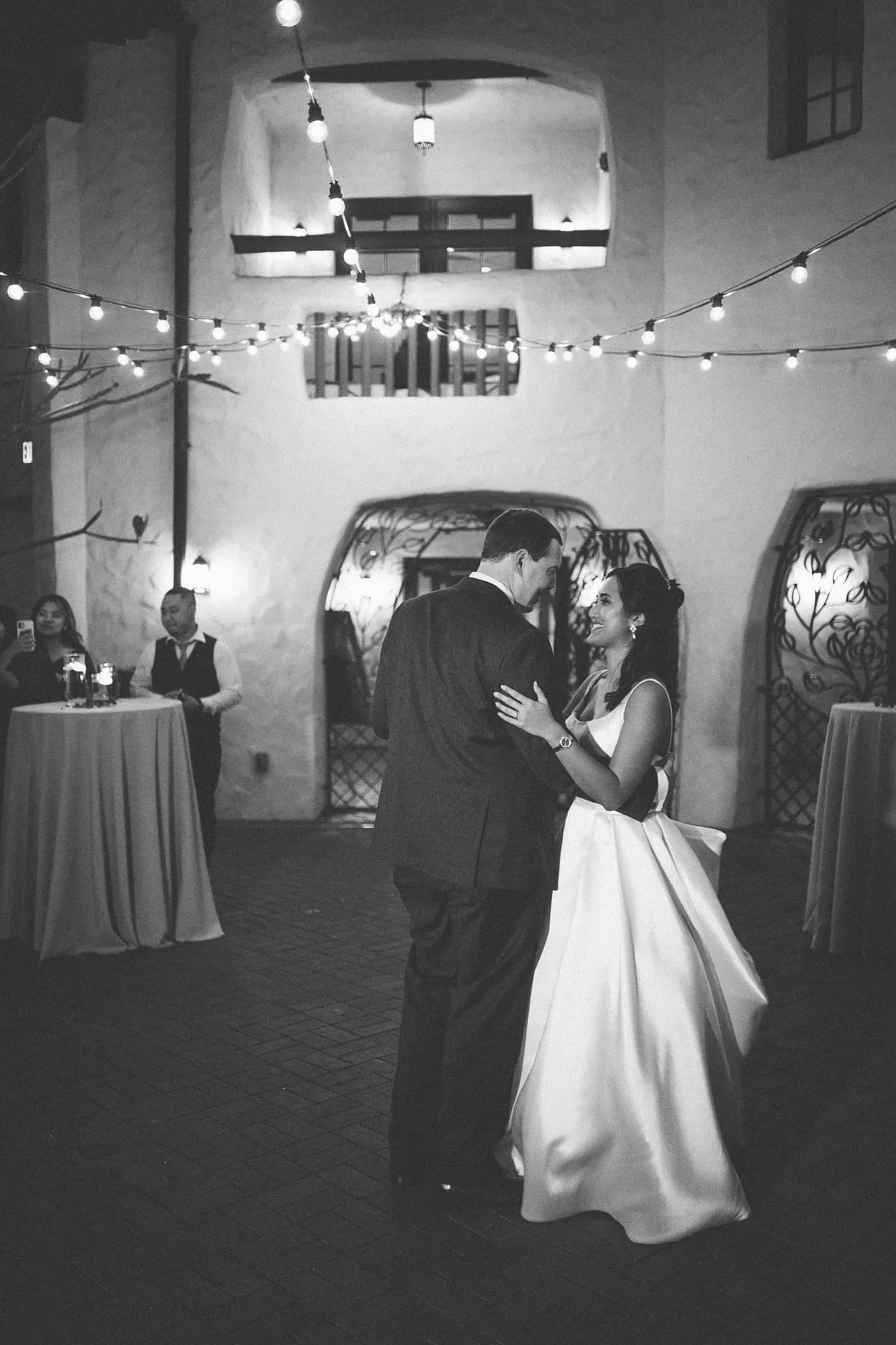 Groom Dancing with Husband Under Lights In A Sexy Wedding Dress Ball Gown Named Selena By Maggie Sottero