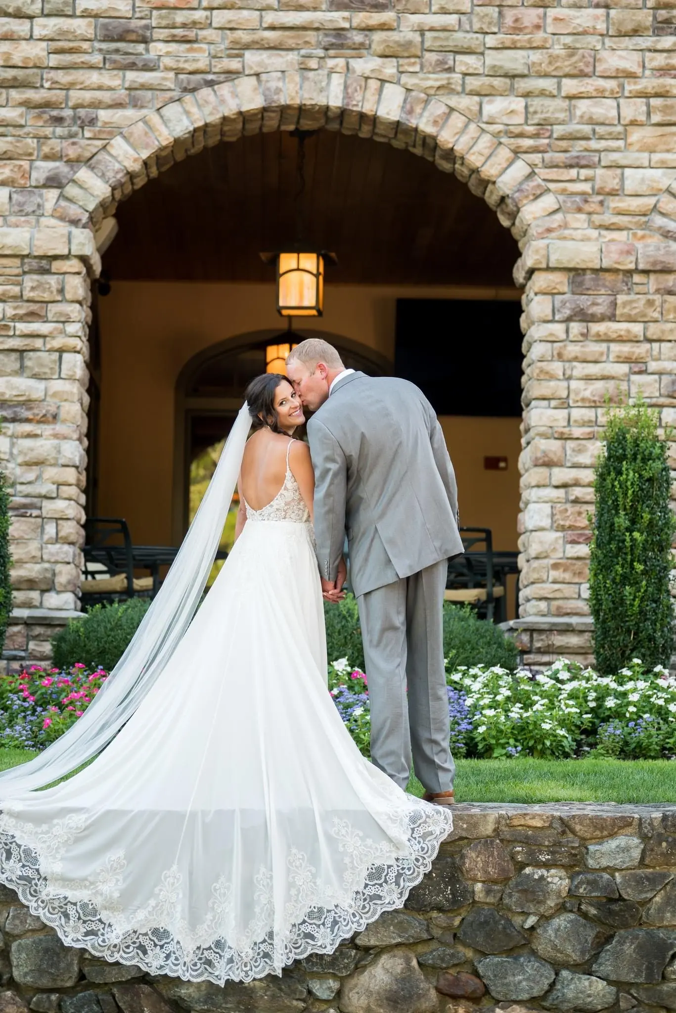 Groom With Bride Wearing Chiffon Wedding Dress With Flirty Lace Primrose By Maggie Sottero