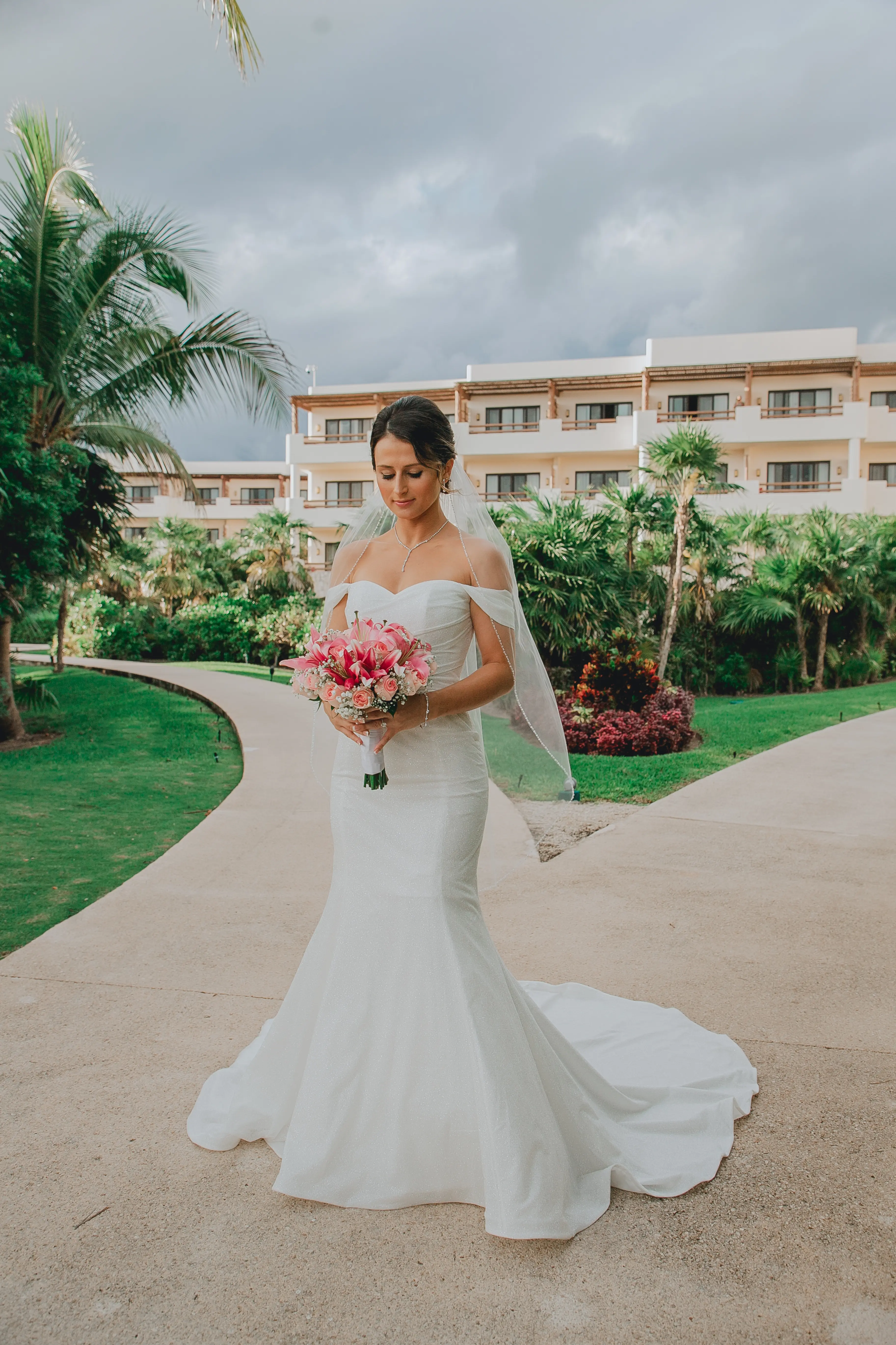 Bride Wearing Sparkly Fit And Flare Wedding Dress Called Anniston Lane By Maggie Sottero Holding A Vibrant Pink Bouquet