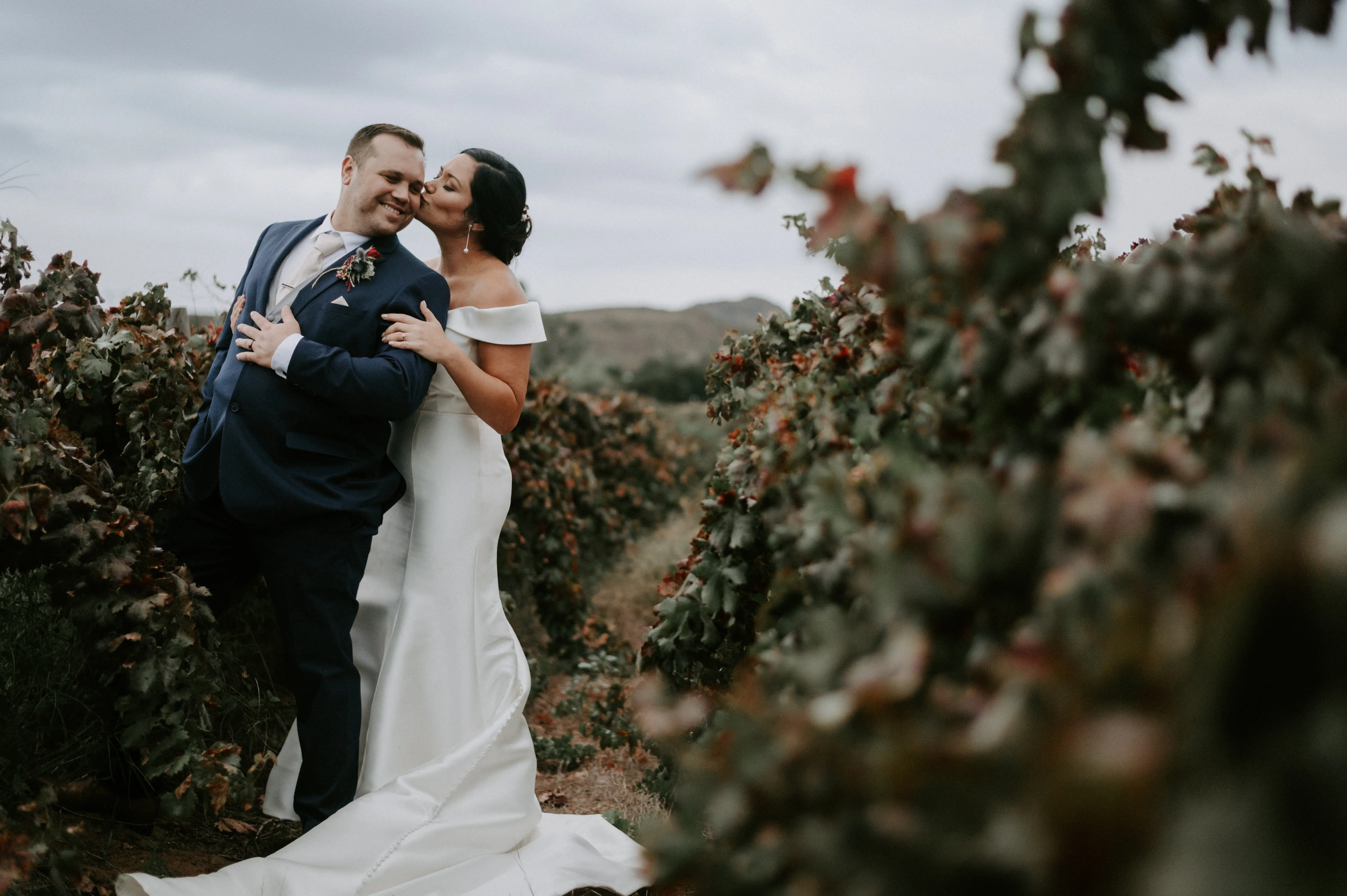 Groom With Bride Wearing Vintage Off The Shoulder Fit-And-Flare Wedding Dress Josie By Rebecca Ingram