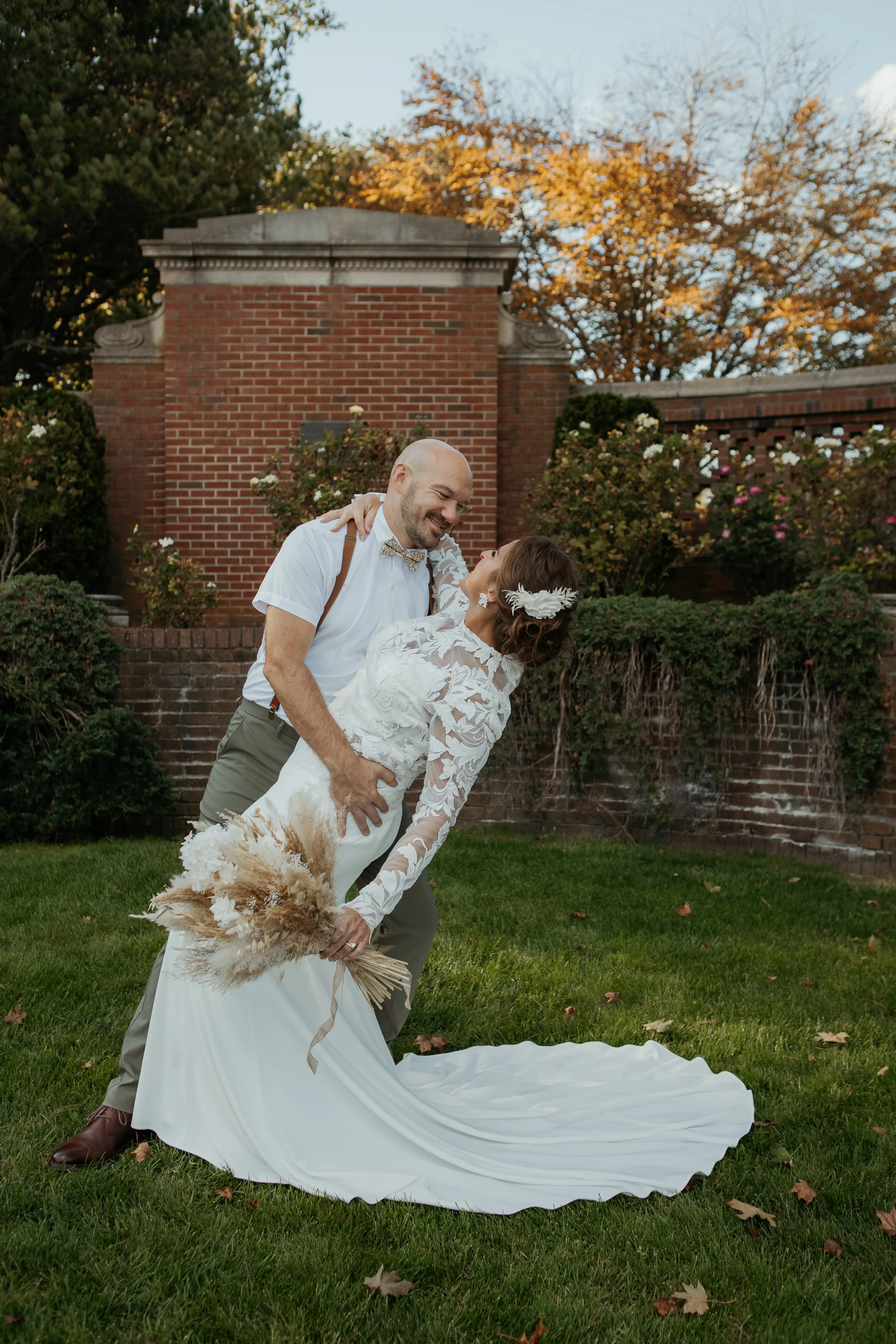Bride Wearing Crepe Wedding Dress Called Dionne By Rebecca Ingram With Groom Dipping Her