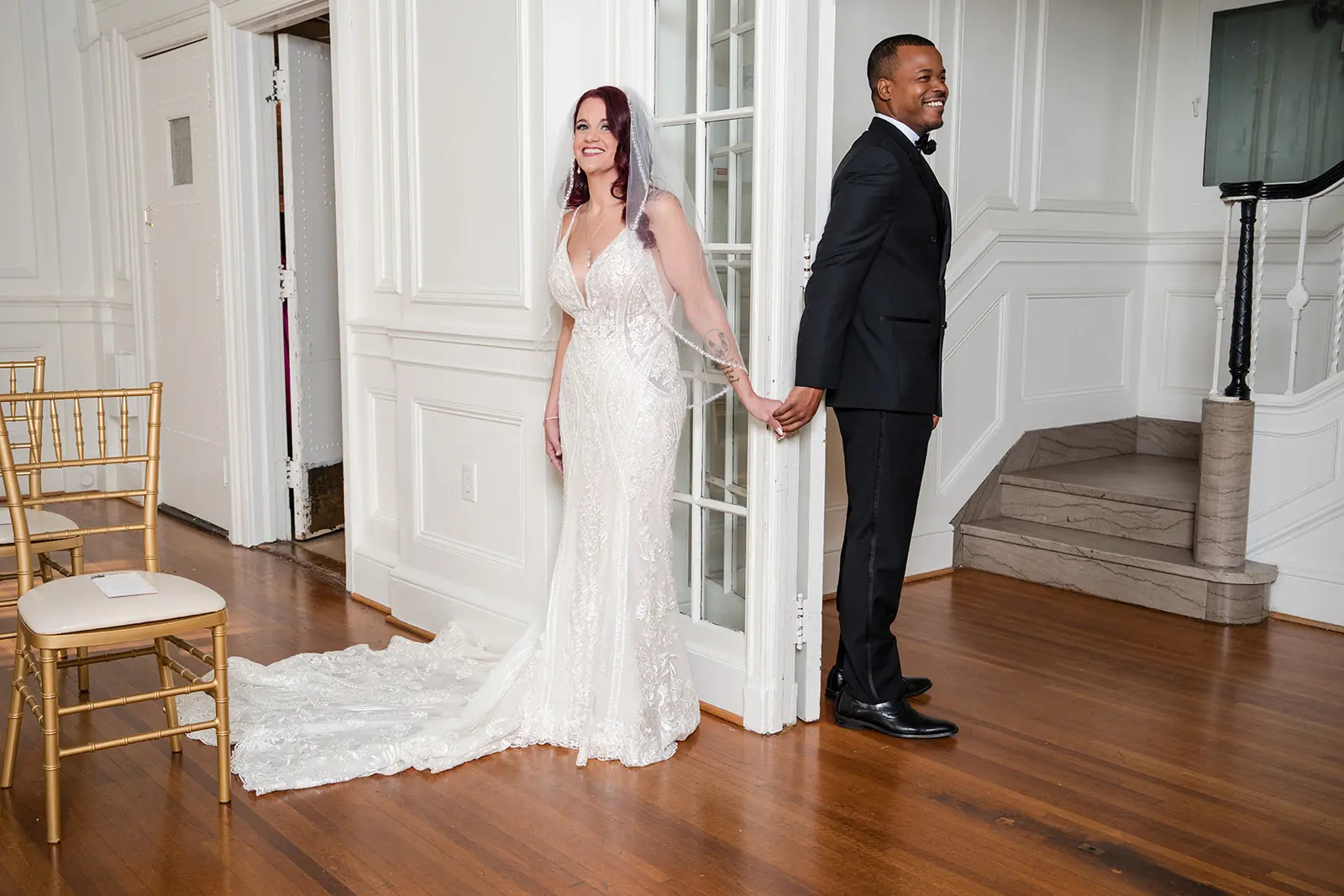 Bride wearing Bailey by Sottero and Midgley holding hands with her husband