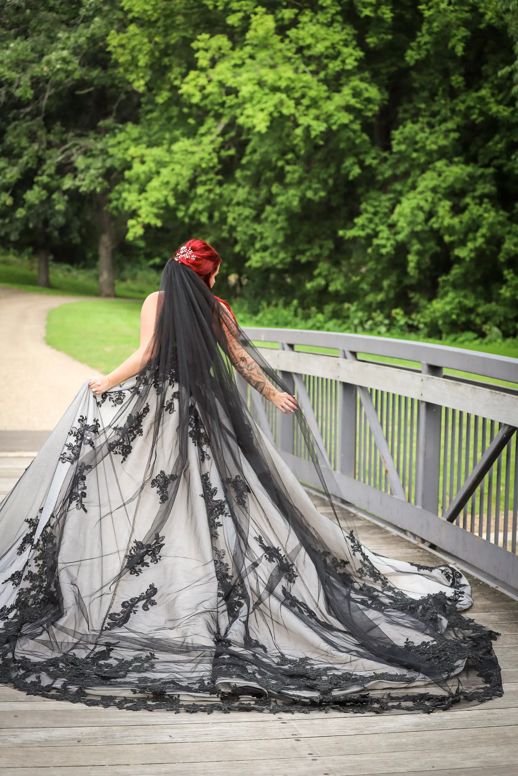 Bride Wearing Royal-Inspired Ball Gown Wedding Dress In Black Lace Called Norvinia By Sottero And Midgley