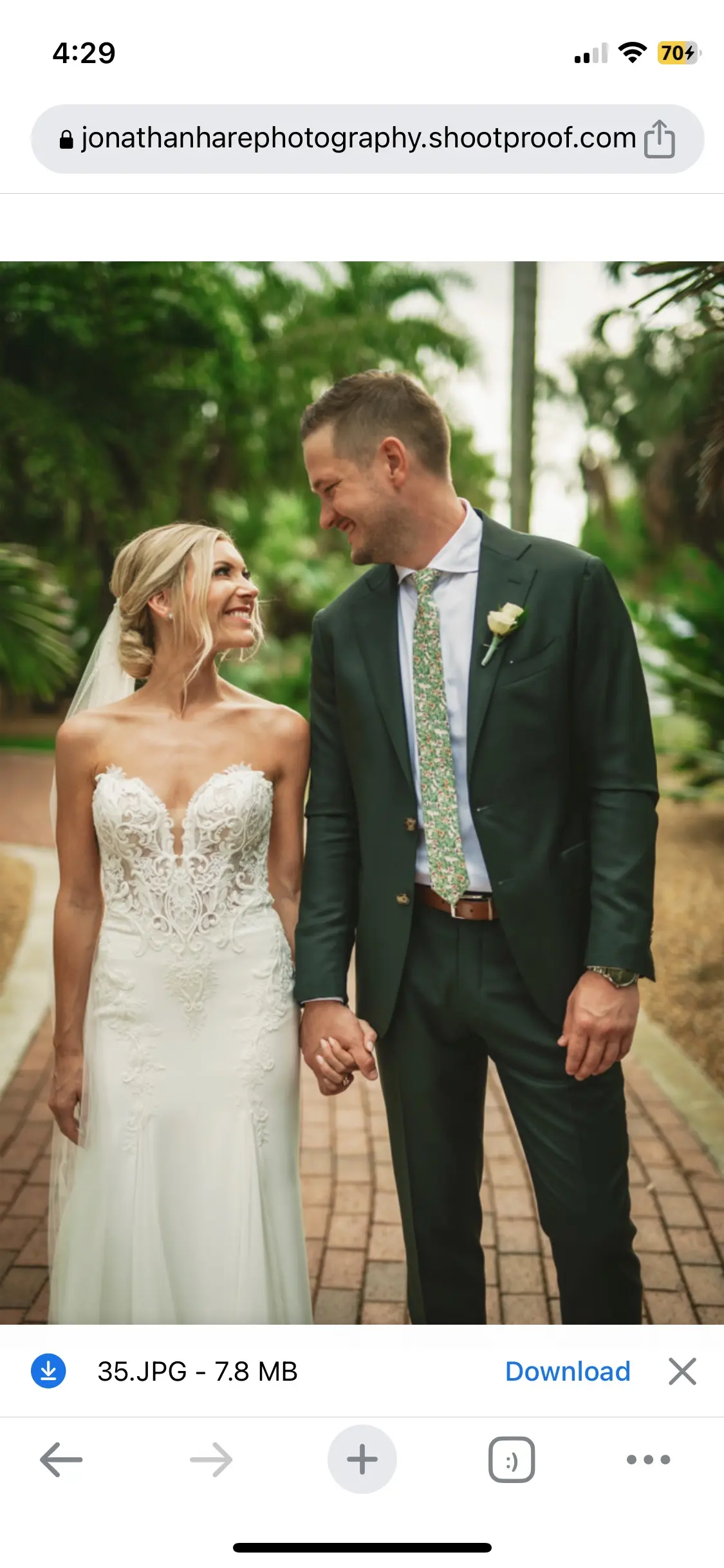 Real Bride in Fit-and-Flare Strapless Chiffon Wedding Gown with Sequined Lace Motifs over Chantilly Lace with Corset Detailing Called Giovannetta by Sottero & Midgley