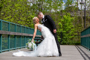 Groom with Real Bride in Strapless Mermaid Bridal Gown with Oversized Floral Lace Motifs over Sparkle Tulle called Hattie by Rebecca Ingram