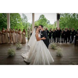 Bride wearing Talitha by Sottero and Midgley kissing her husband