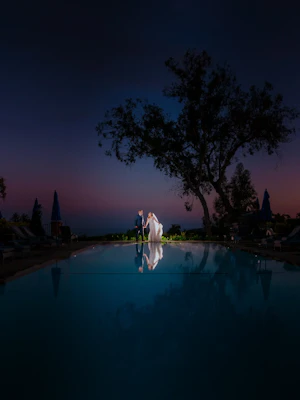 Bride with groom wearing a sexy low back wedding dress