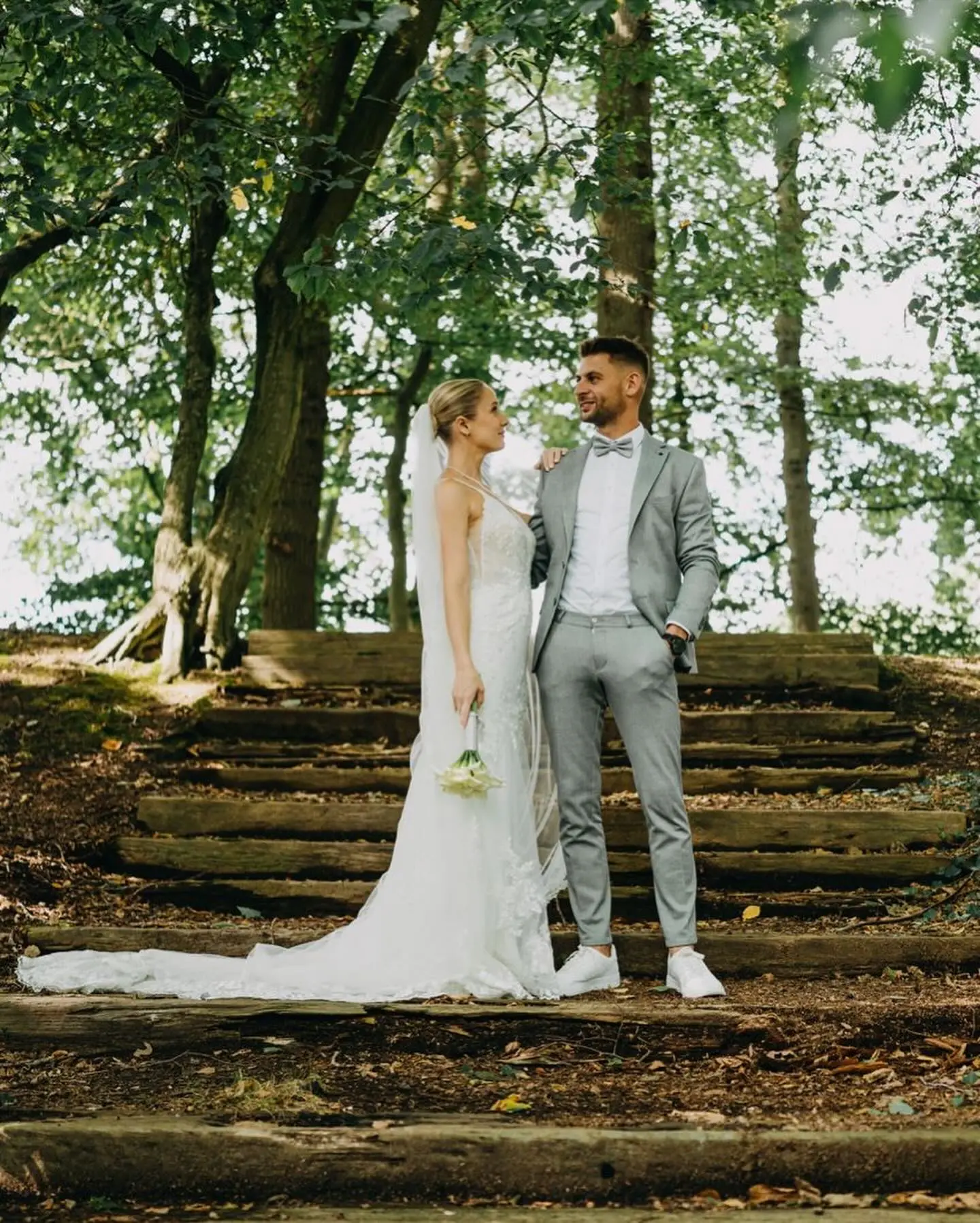 Bride wearing Fontaine by Maggie Sottero looking at her husband