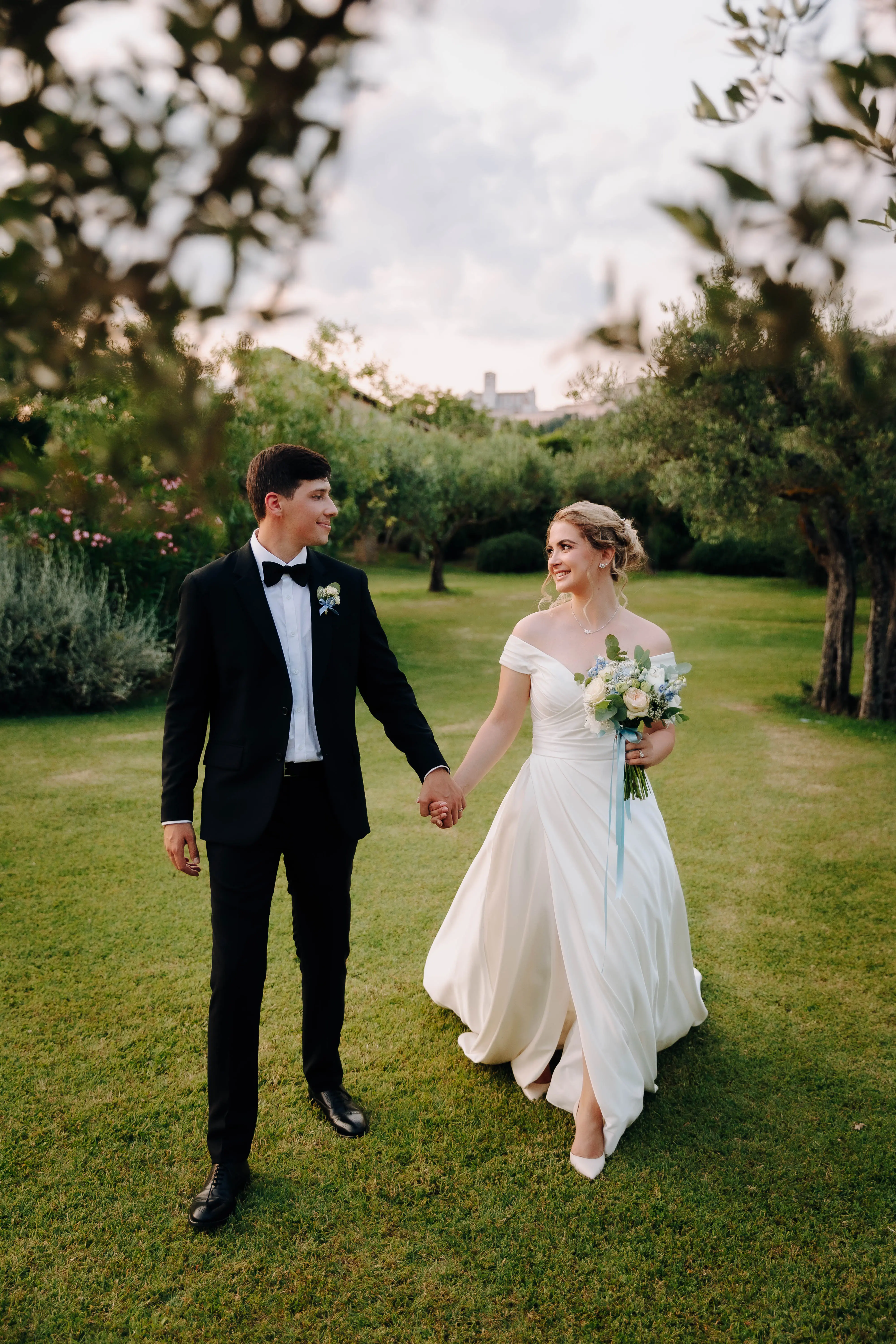 Bride Wearing A-line Classic Wedding Dress Ekaterina By Maggie Sottero Holding Hands With Groom
