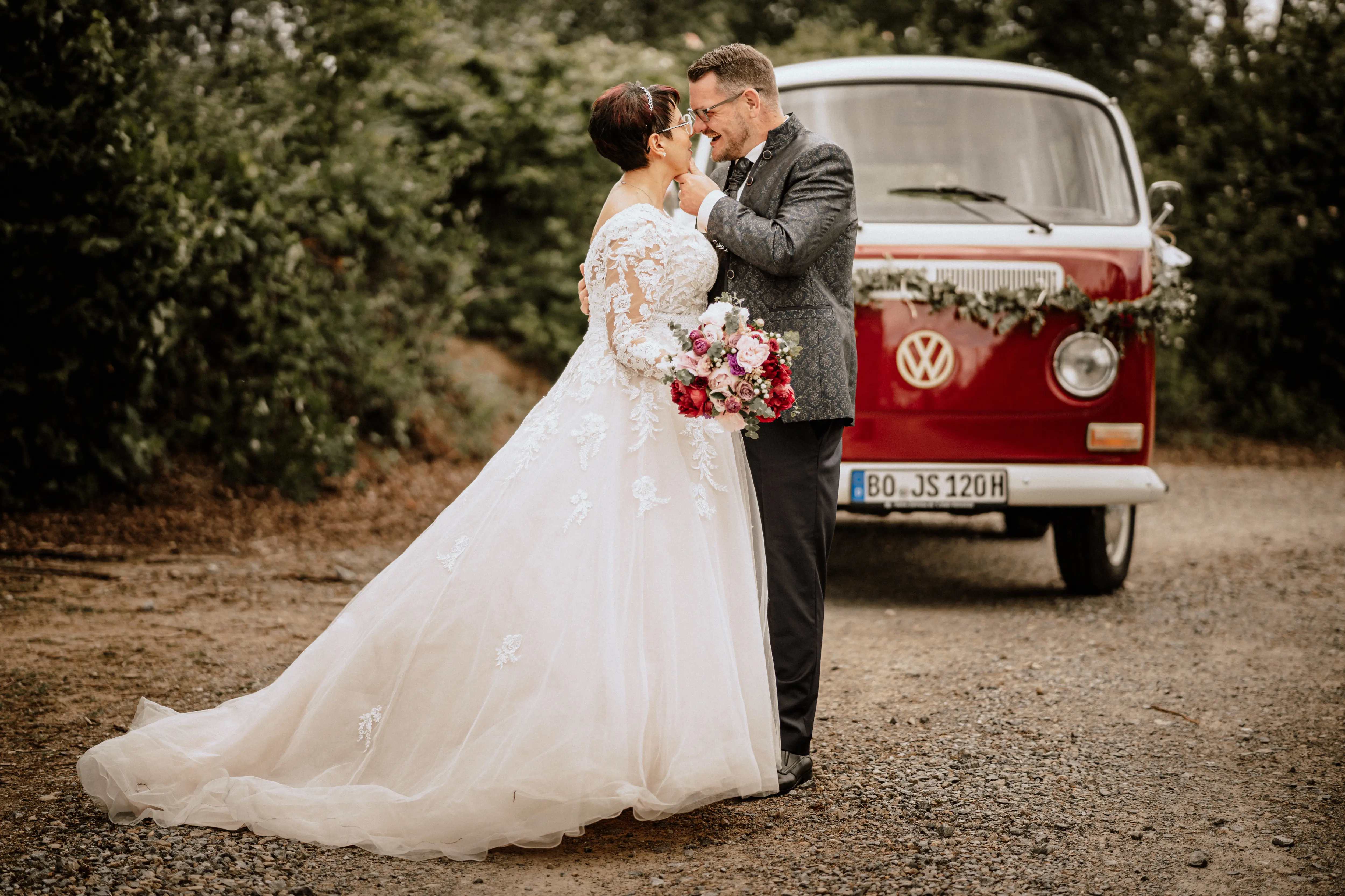 Bride in Long Sleeve Ivory Wedding Dress Raphael with Groom