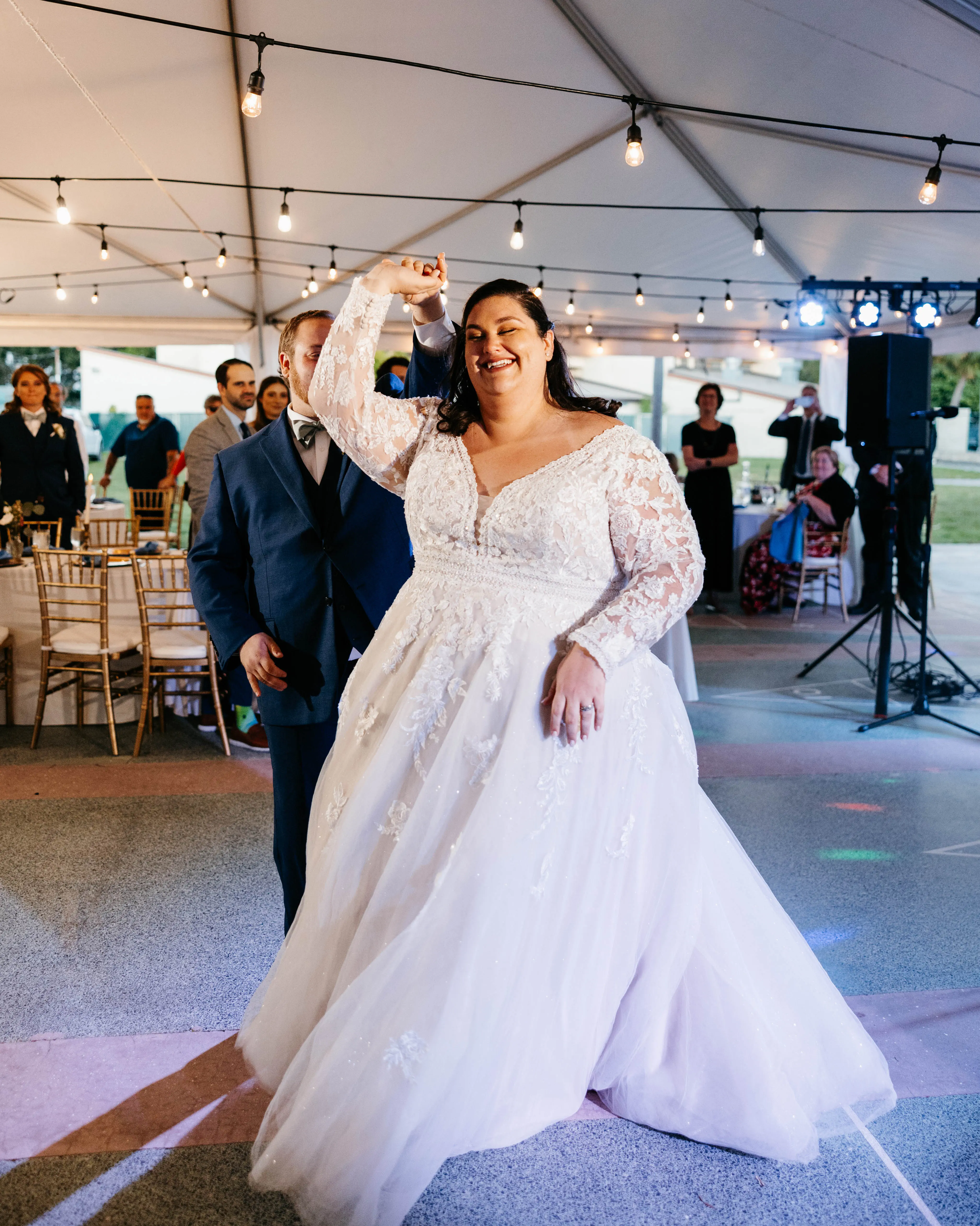Groom With Bride Wearing Illusion Sleeve A-Line Wedding Dress Raphael By Maggie Sottero