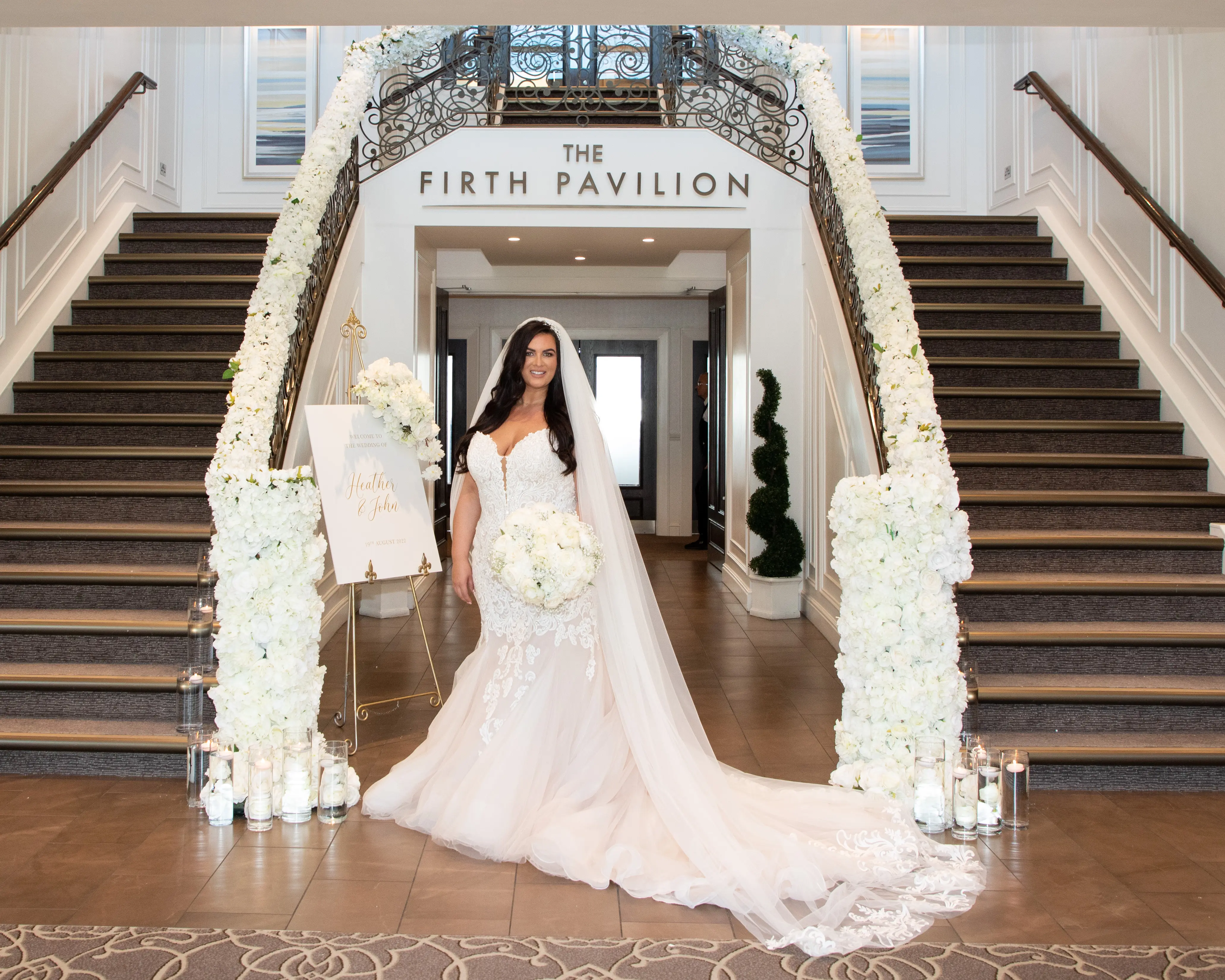 Bride in plunging sweetheart neckline wedding dress called Alistaire by Maggie Sottero
