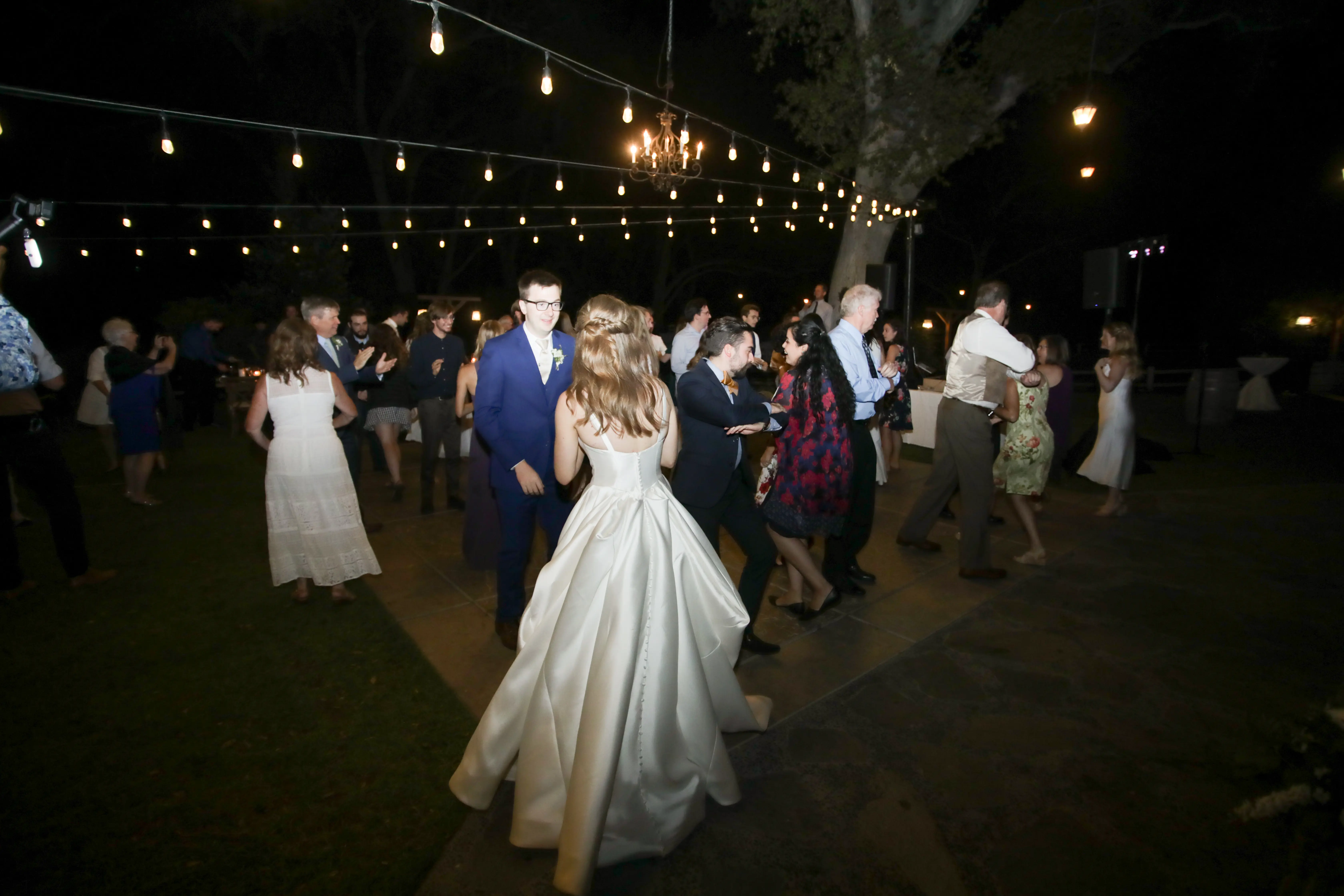 Groom and bride wearing Simple Ballgown Wedding Dress called Selena by Maggie Sottero while dancing