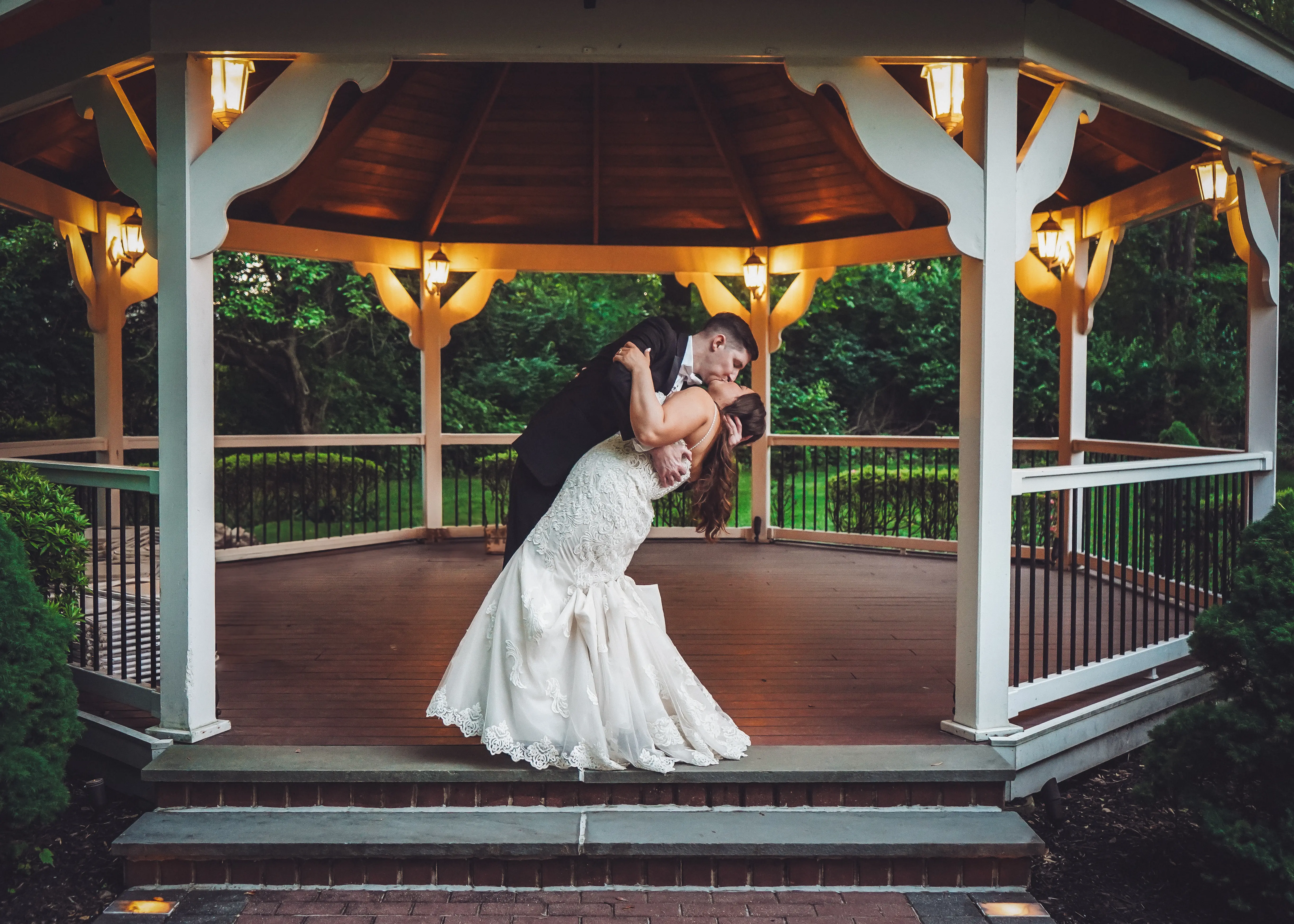 Bride wearing Fiona by Maggie Sottero kissing her husband