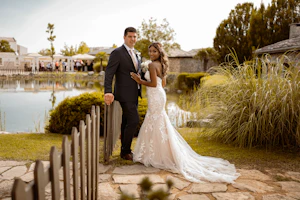 Groom With Bride Wearing Mermaid Wedding Dress With Oversized Lace Hattie By Rebecca Ingram