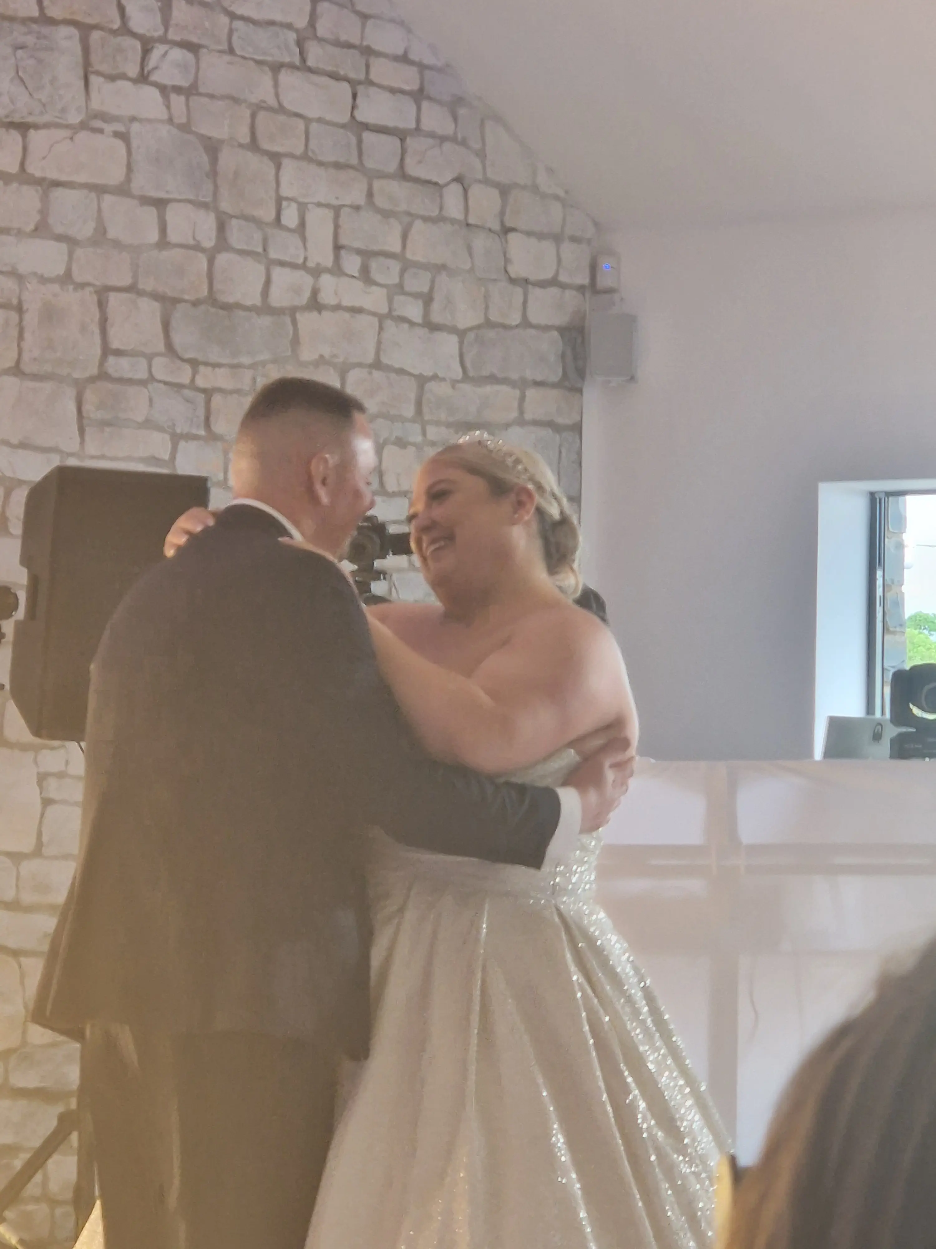 Bride wearing Anniston by Maggie Sottero dancing with her husband