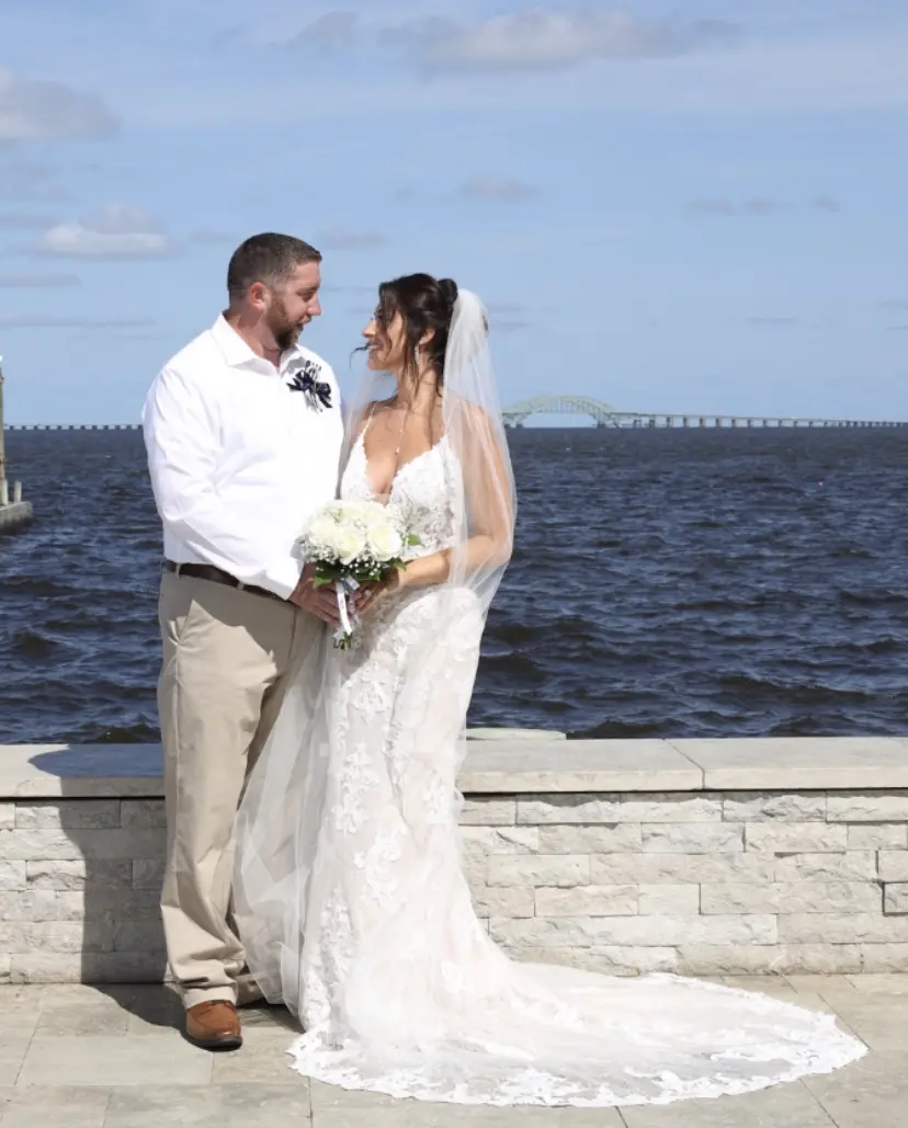 Groom With Bride Wearing Lace Sheath Wedding Dress Tuscany Lynette By Maggie Sottero