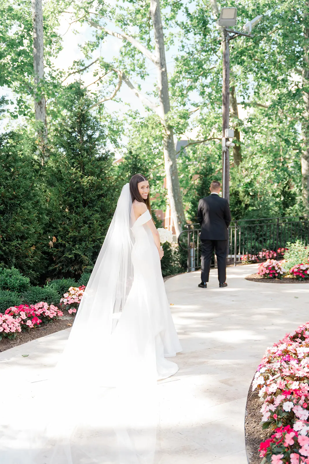Bride wearing Anniston Lane by Maggie Sottero doing a first look with her husband