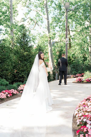 Bride wearing Anniston Lane by Maggie Sottero doing a first look with her husband