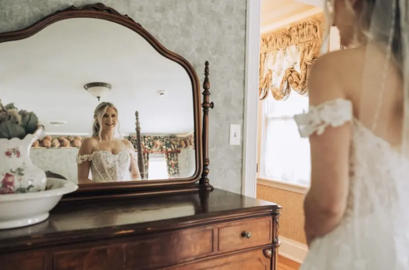 Bride Wearing Lace Aline Bridal Gown Called Harlem By Maggie Sottero Looking In The Mirror