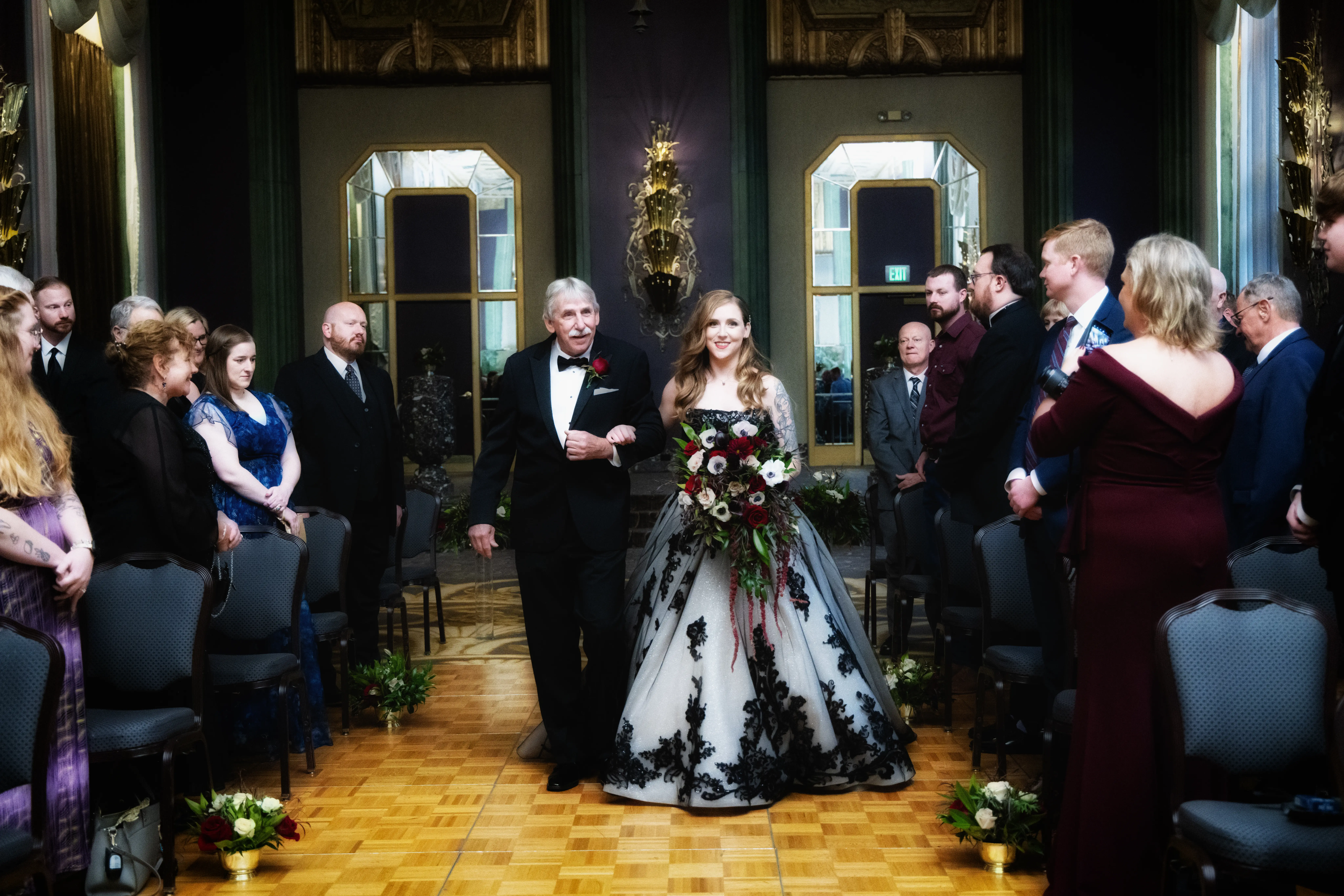 Bride wearing Norvinia wedding dress by Sottero and Midgley walking down the aisle with her dad