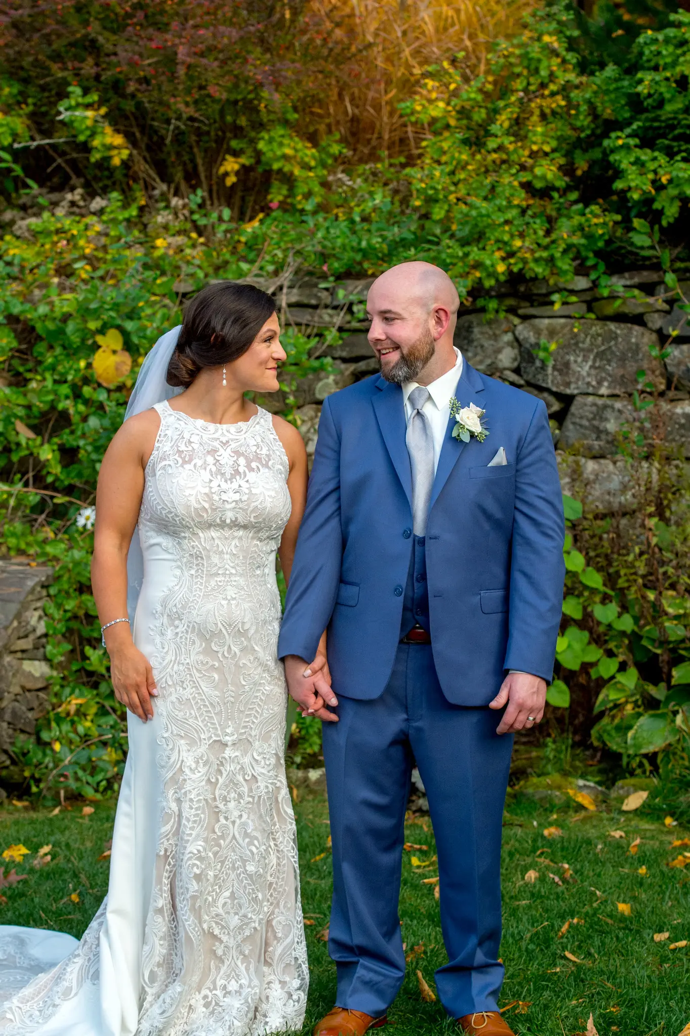 Bride wearing Lace Sheath Wedding Dress called Kevyn by Sottero and Midgley with groom