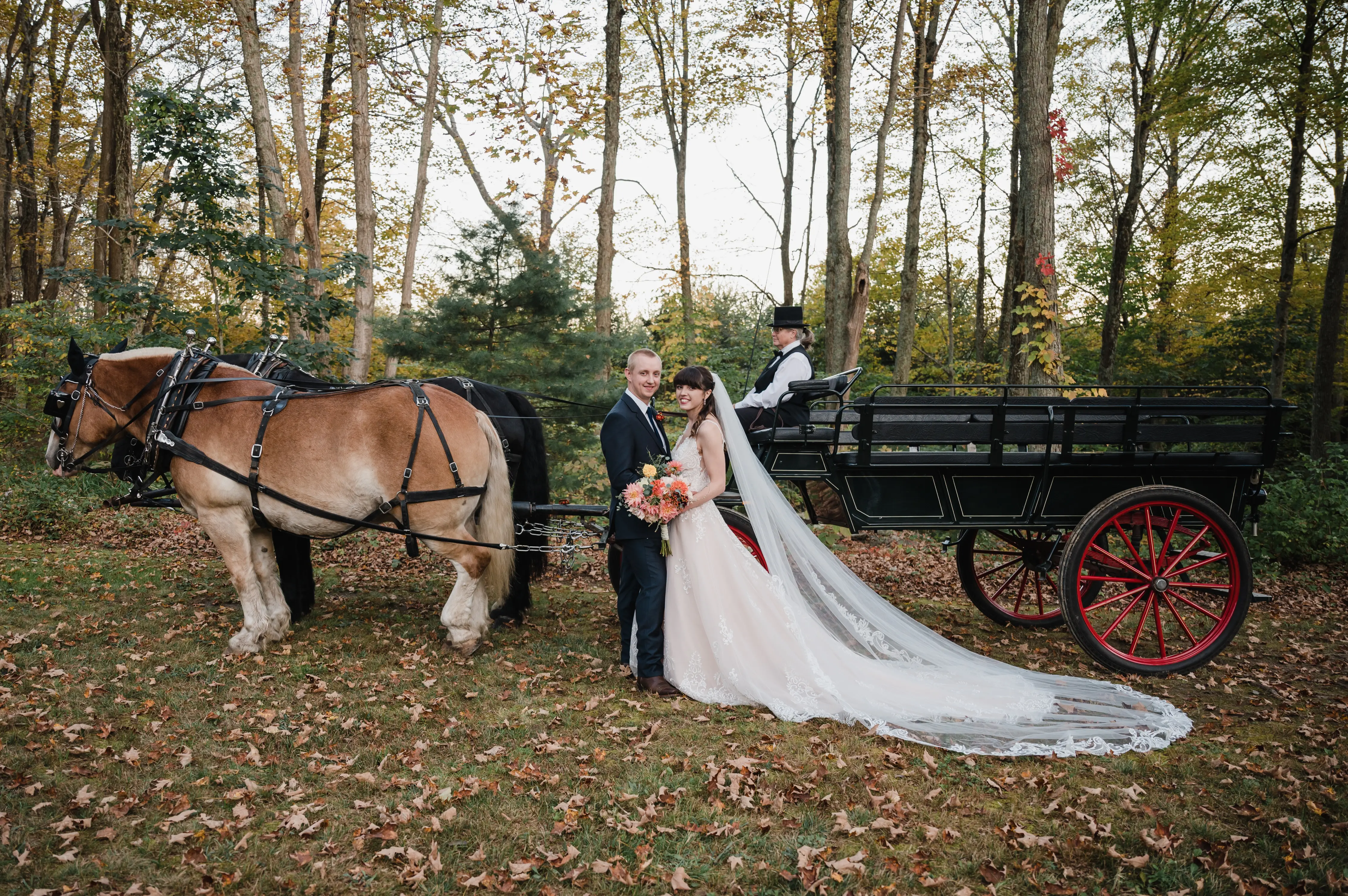 Bride Wearing Lace A-Line Wedding Dress Called Wallis By Maggie Sottero With Groom Next To A Horse Drawn Carriage
