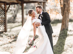 Groom With Bride In Off The Shoulder Mikado Wedding Dress Named Josie By Rebecca Ingram