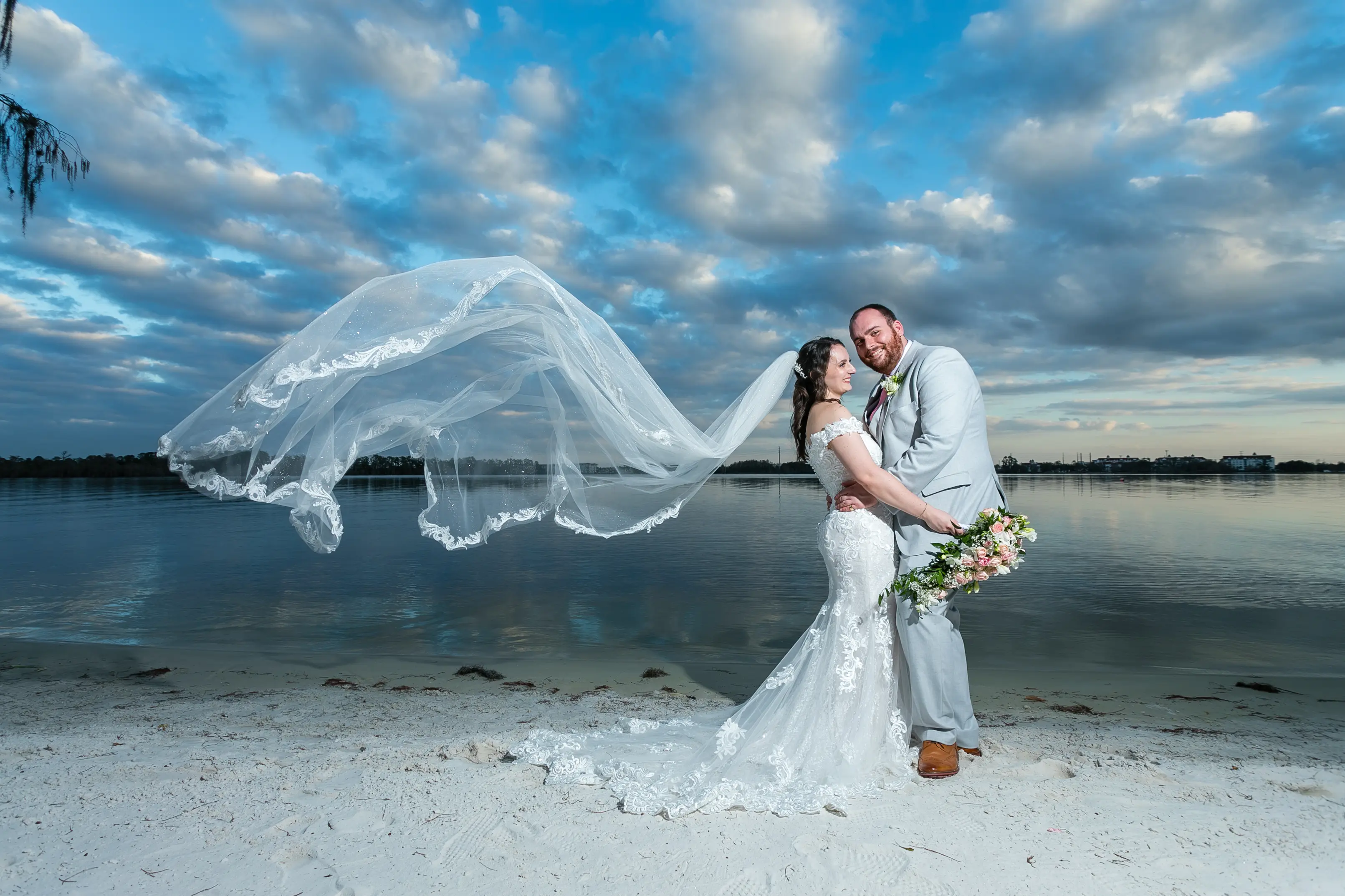 Bride In Off The Shoulder Lace Wedding Dress Called Edison By Maggie Sottero With Groom