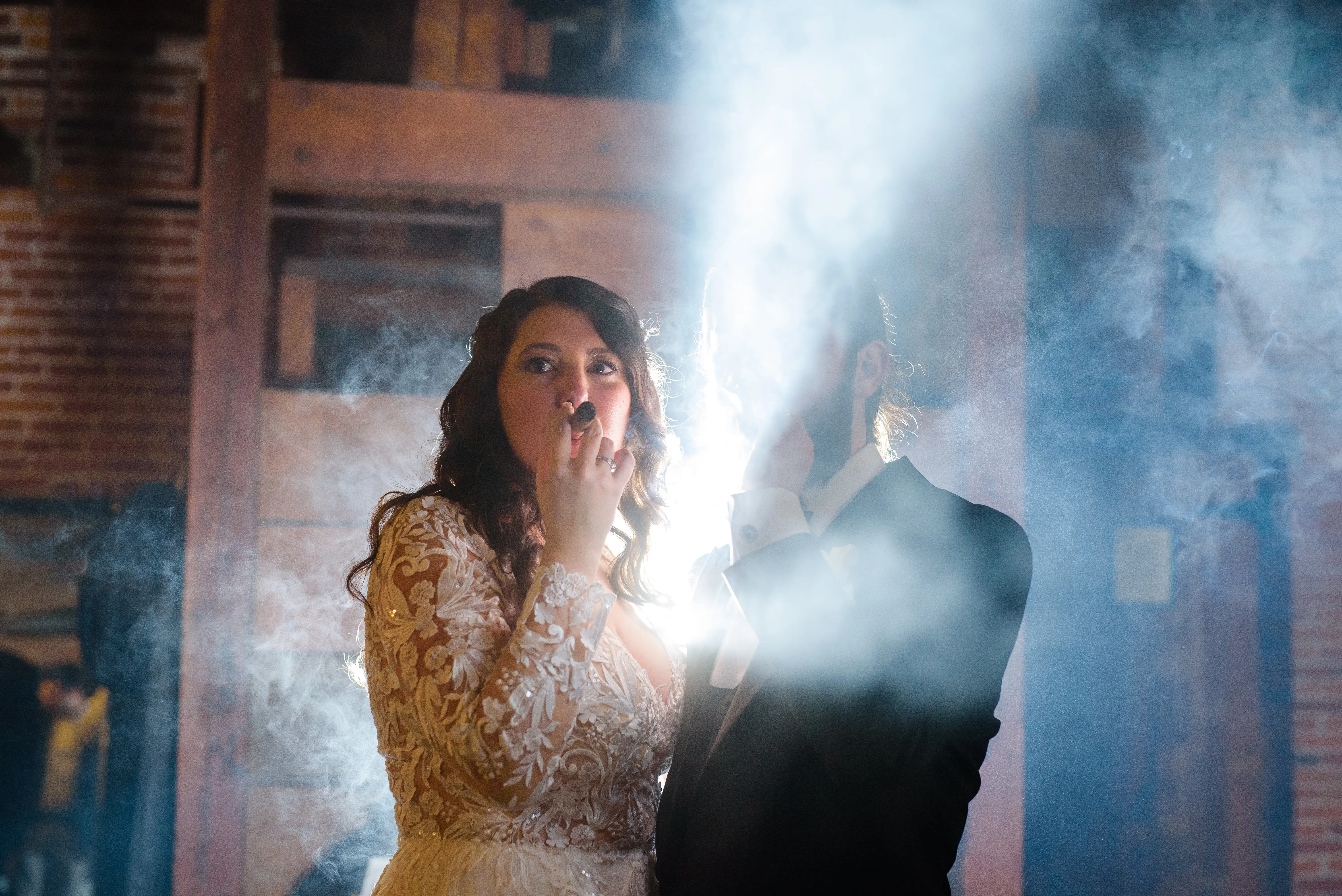 Bride And Groom Standing Together. Bride Wearing Lace Long Sleeve Wedding Dress Called Zander By Sottero And Midgley