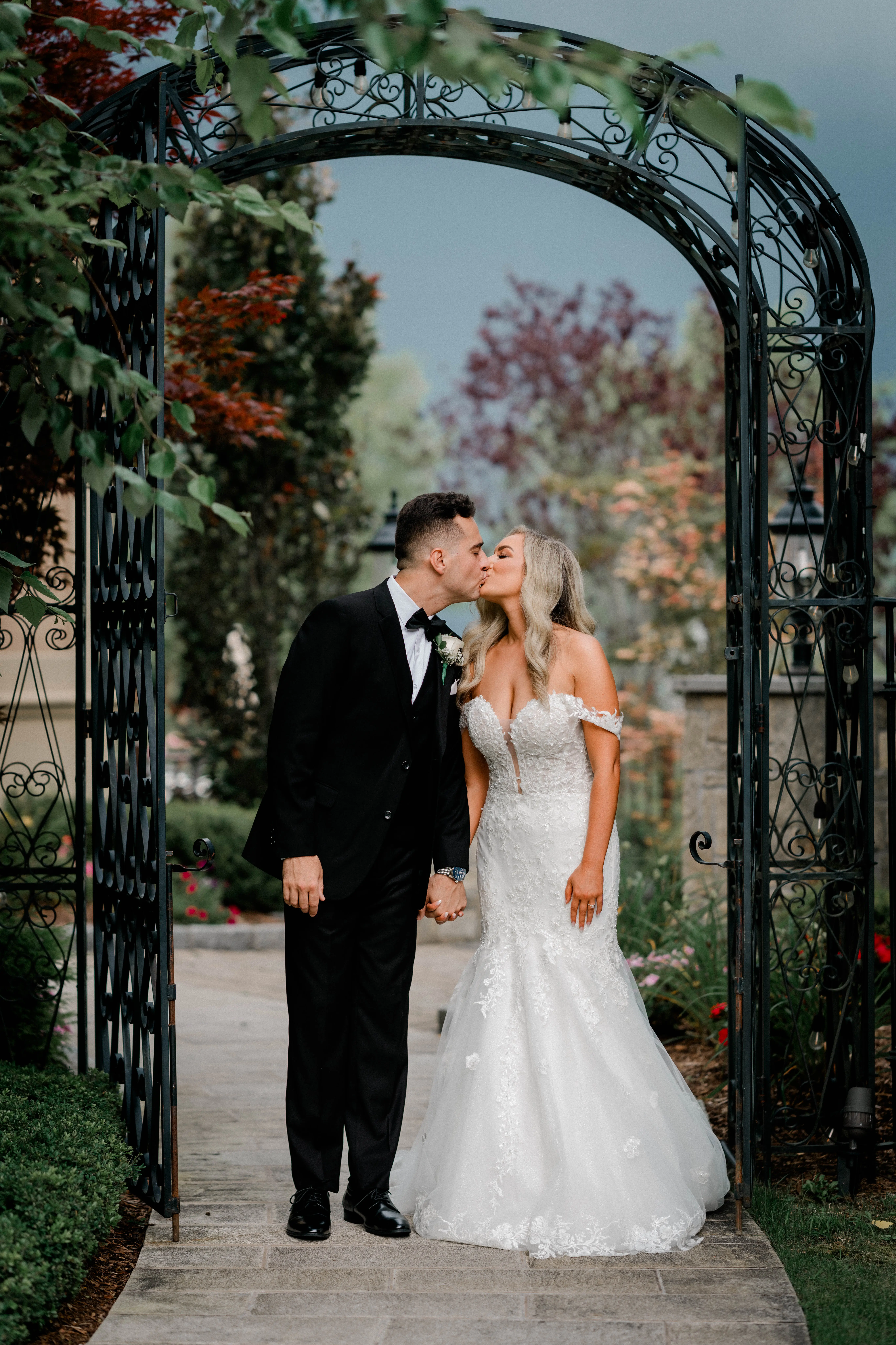 Bride wearing Lennon by Maggie Sottero kissing her husband