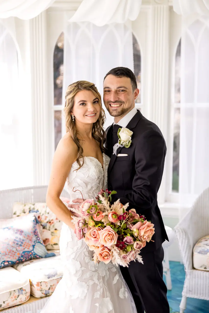 Bride wearing Hattie Marie by Rebecca Ingram standing with her husband