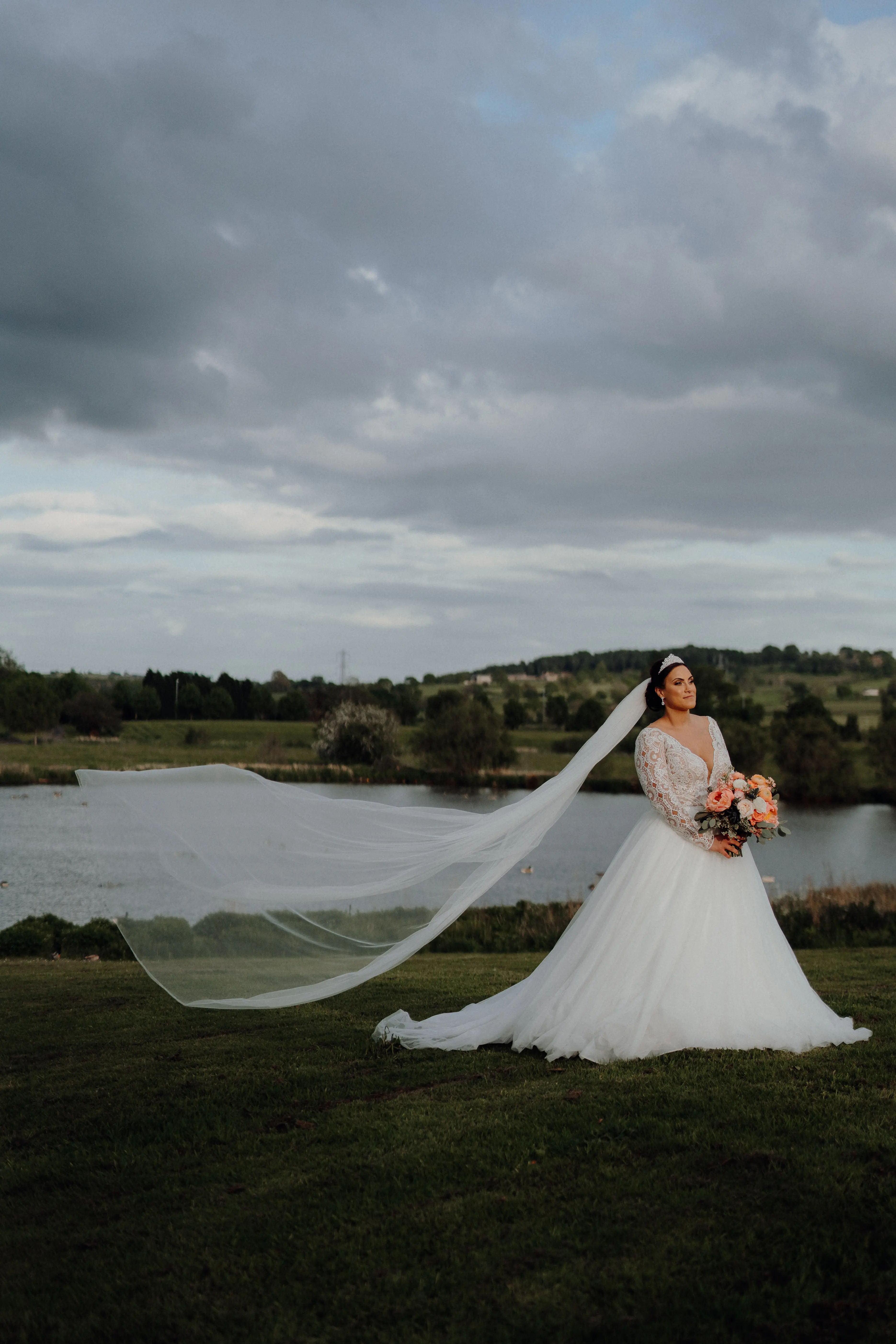 Bride In Long Sleeve Tulle Ball Gown Wedding Dress Called Mallory Dawn By Maggie Sottero With Veil