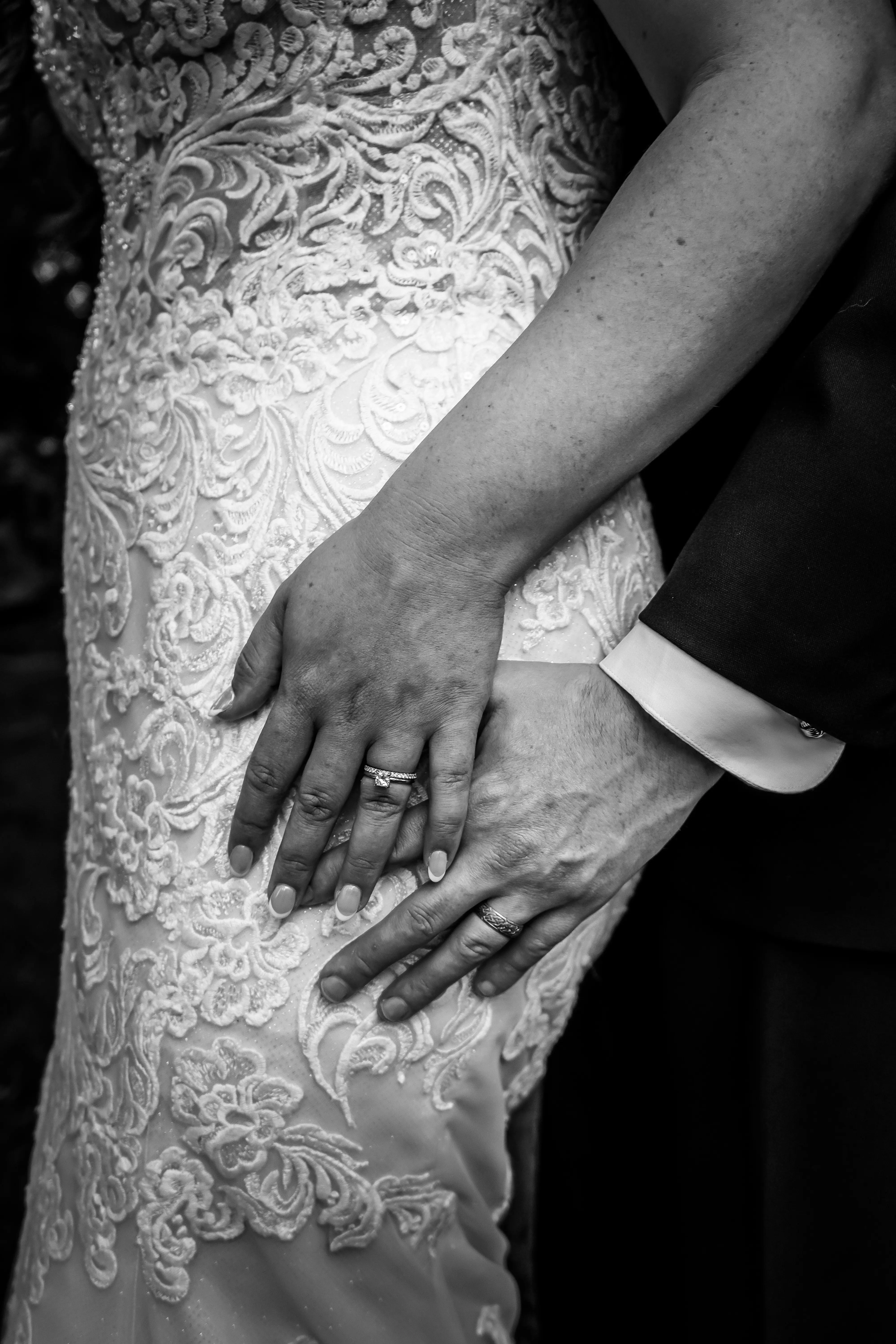 Bride wearing Fiona by Maggie Sottero showing off her and her husband's rings