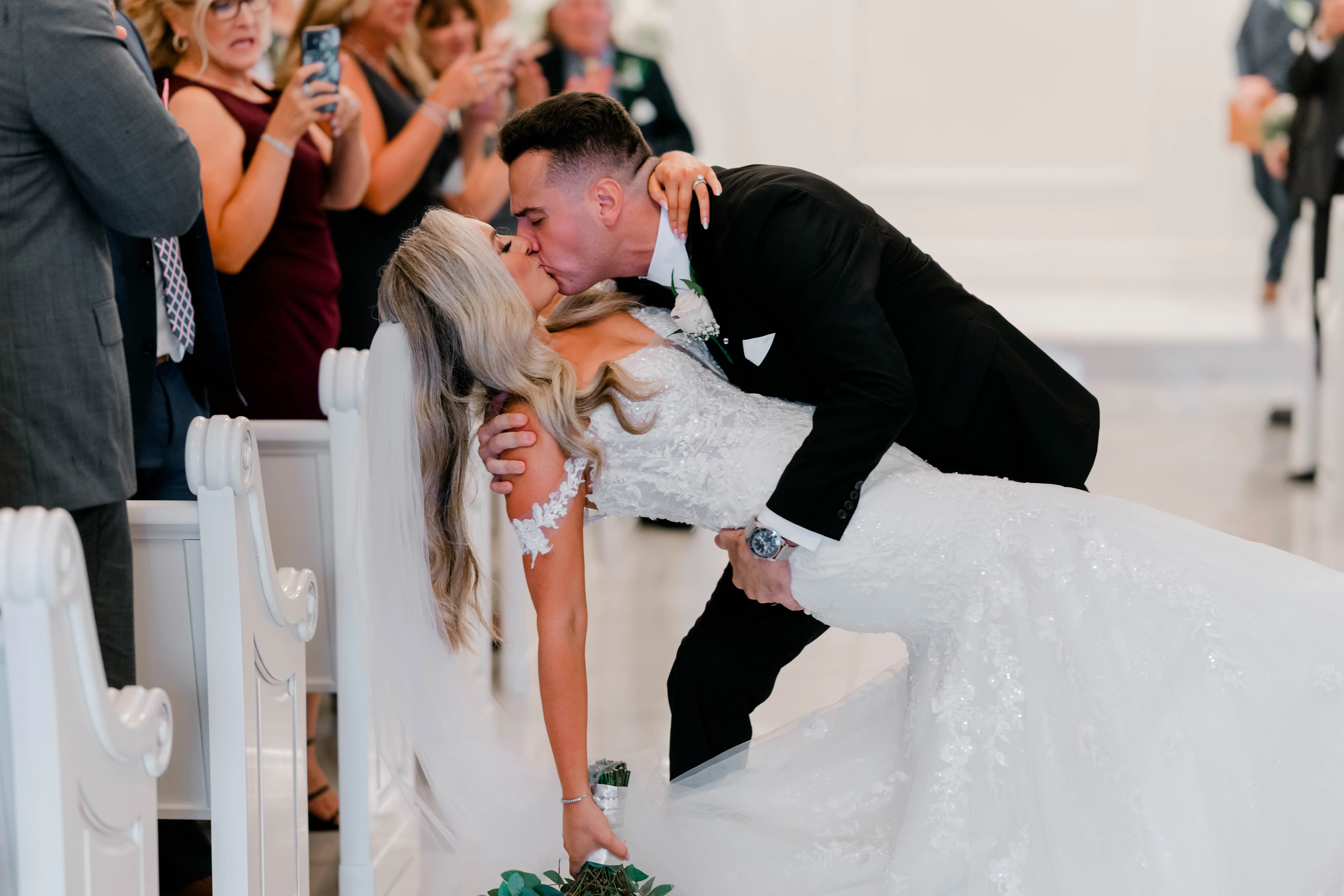 Bride wearing Lennon by Maggie Sottero kissing her husband