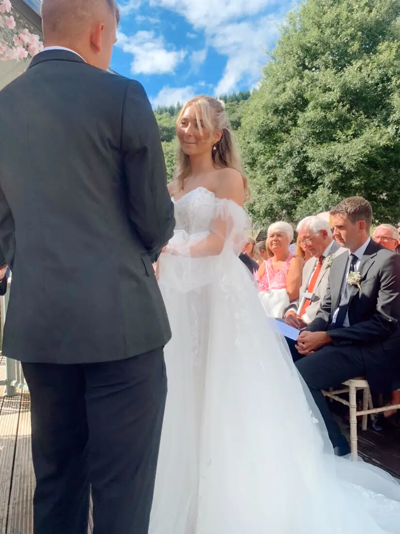 Real Bride in V-Back and Corset Detail Wedding Dress Named Harlem by Maggie Sottero at the Alter