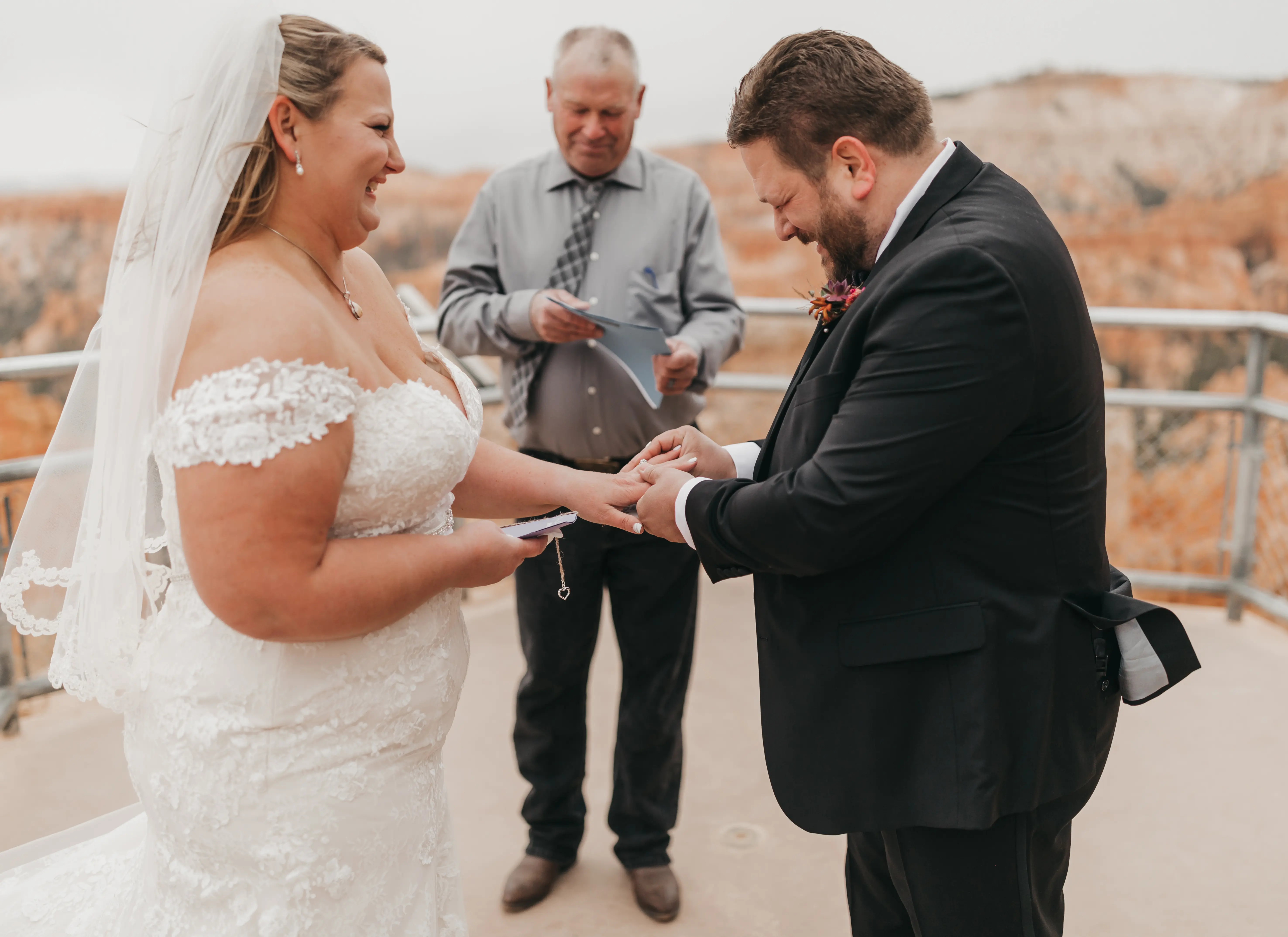 bride with groom in corset back fit and flare wedding dress