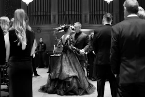 Groom Dancing With Bride In Black Wedding Dress Named Zander By Sottero and Midgley