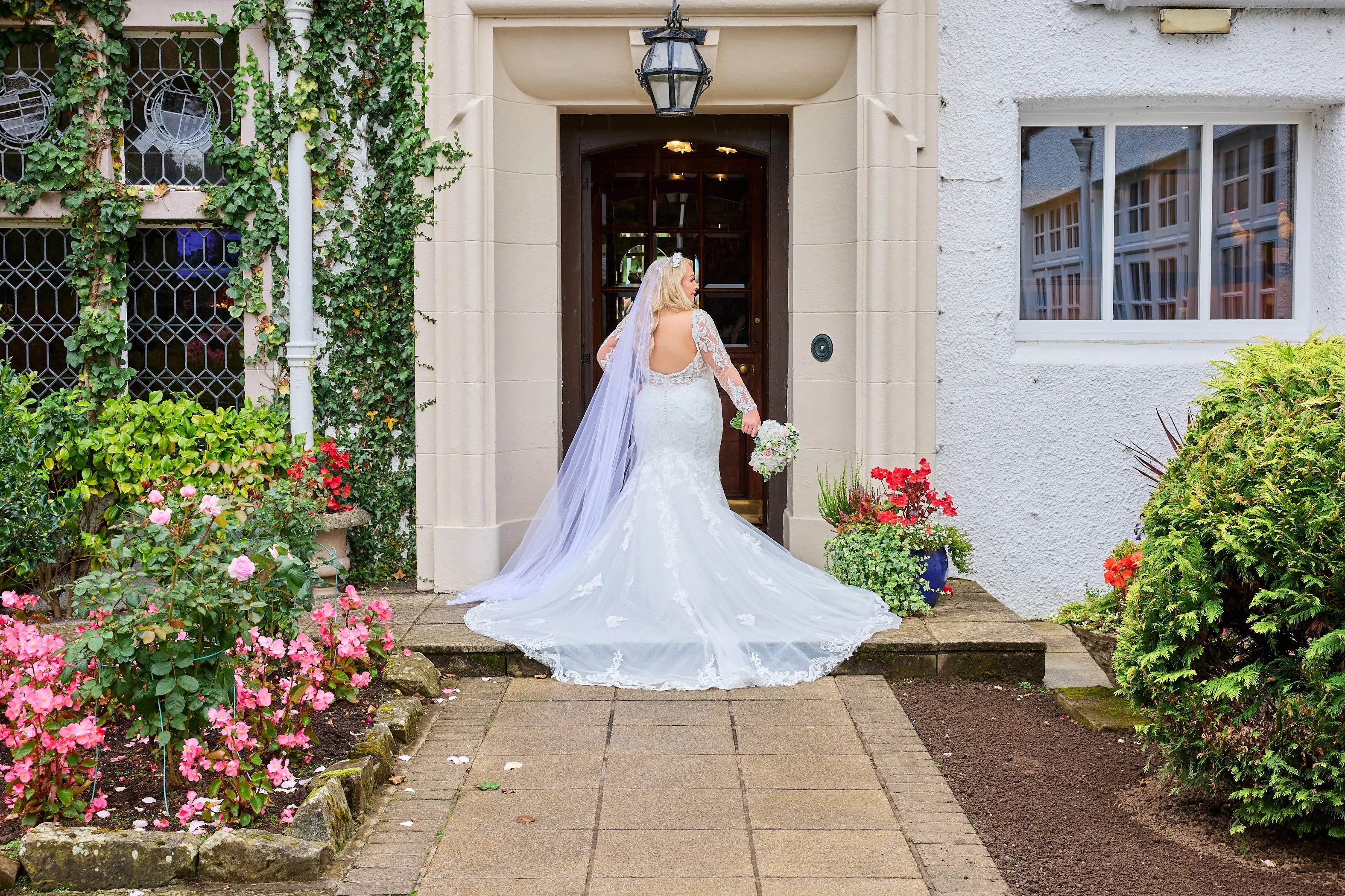 Bride wearing Saige by Maggie Sottero showing off the back of her dress
