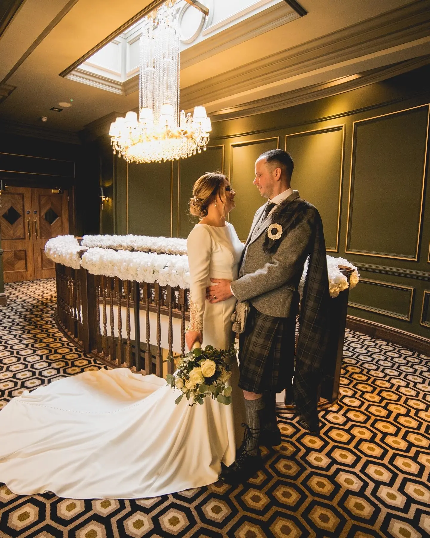 Groom with Bride in Crepe Fit-and-Flare Wedding Dress with Beaded Illusion Embroidery Featuring Swarovski Crystals Called Aston by Sottero & Midgley