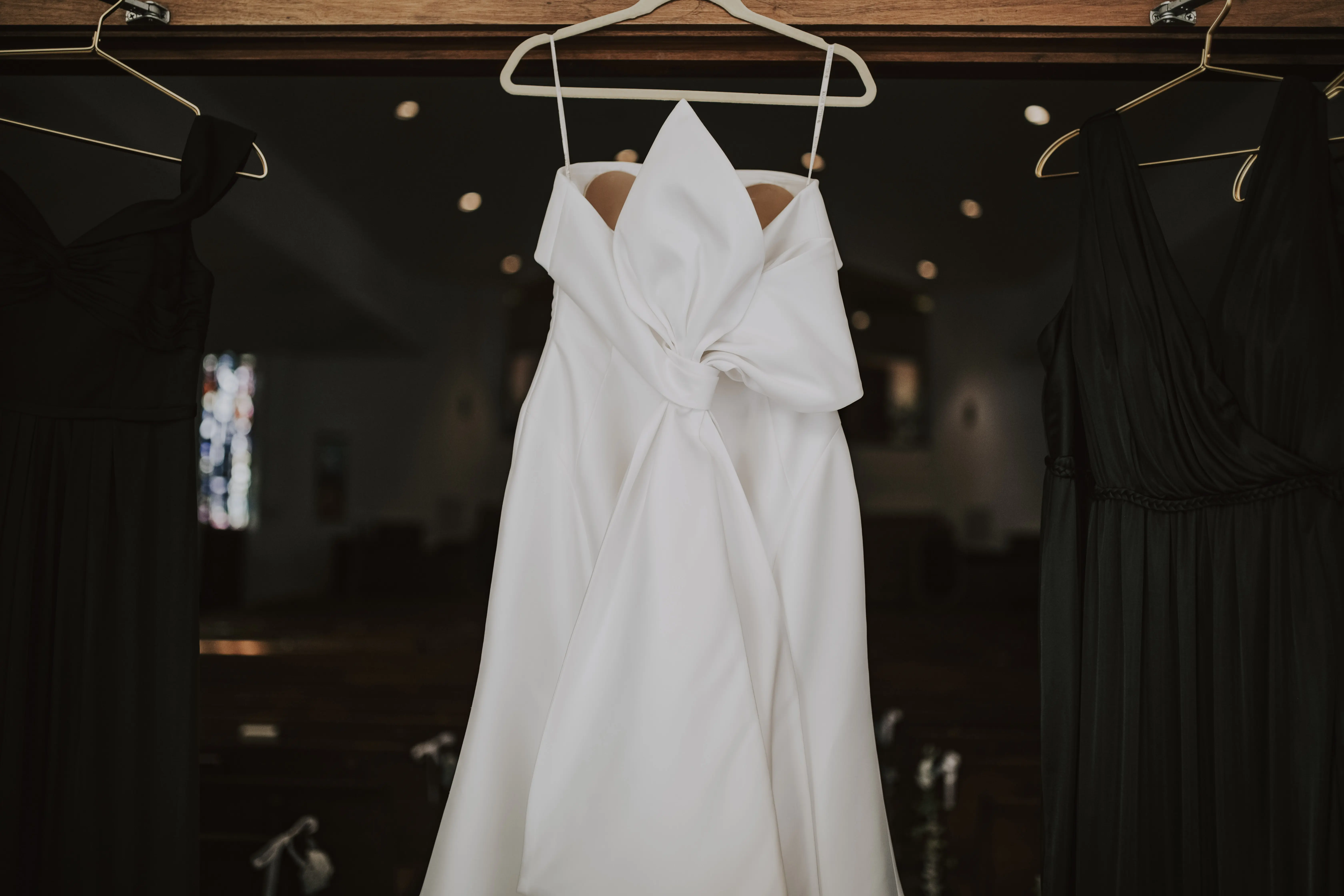 Mitchell wedding dress by Maggie Sottero hanging up
