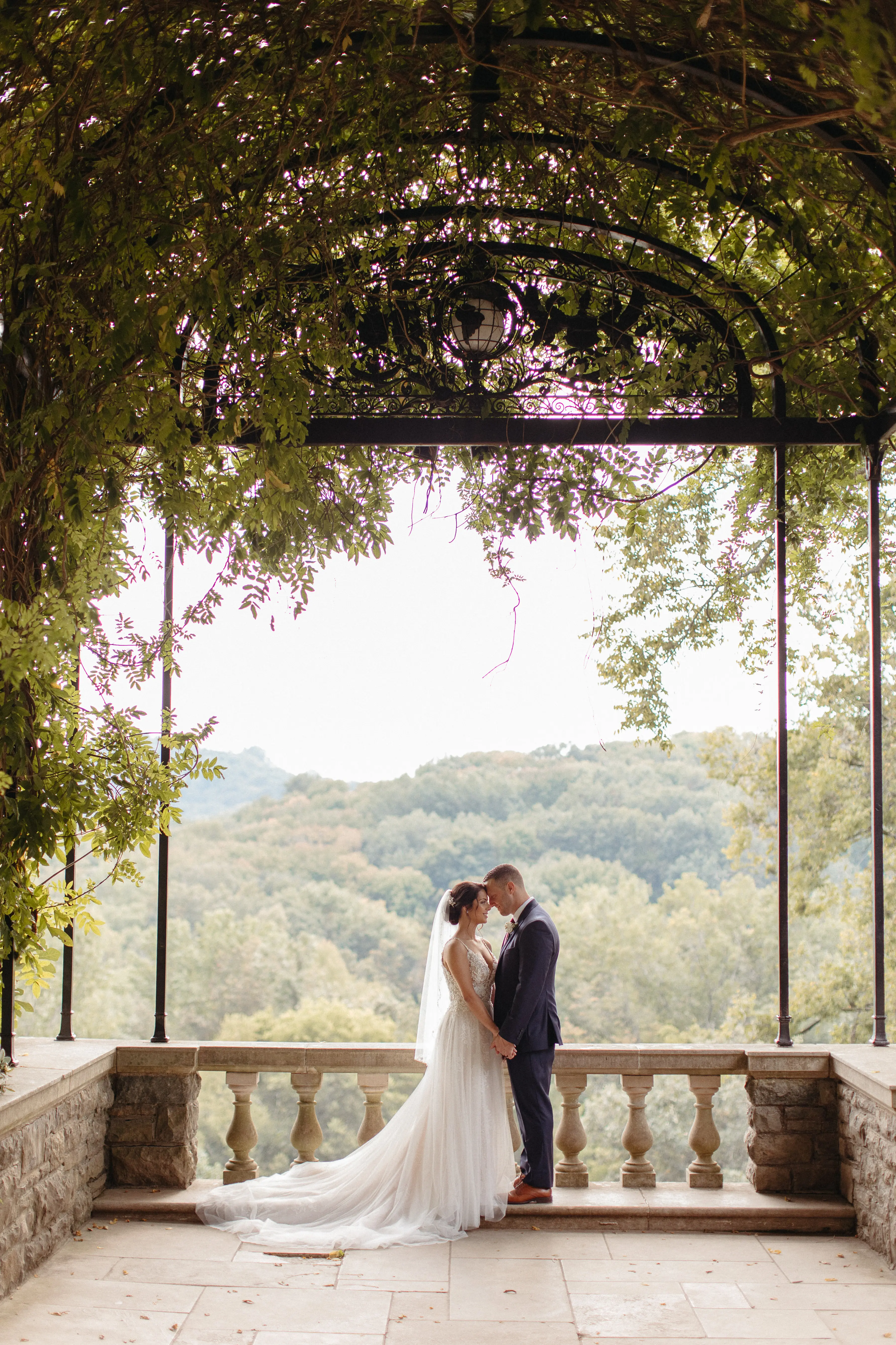 Bride and groom facing each other.
