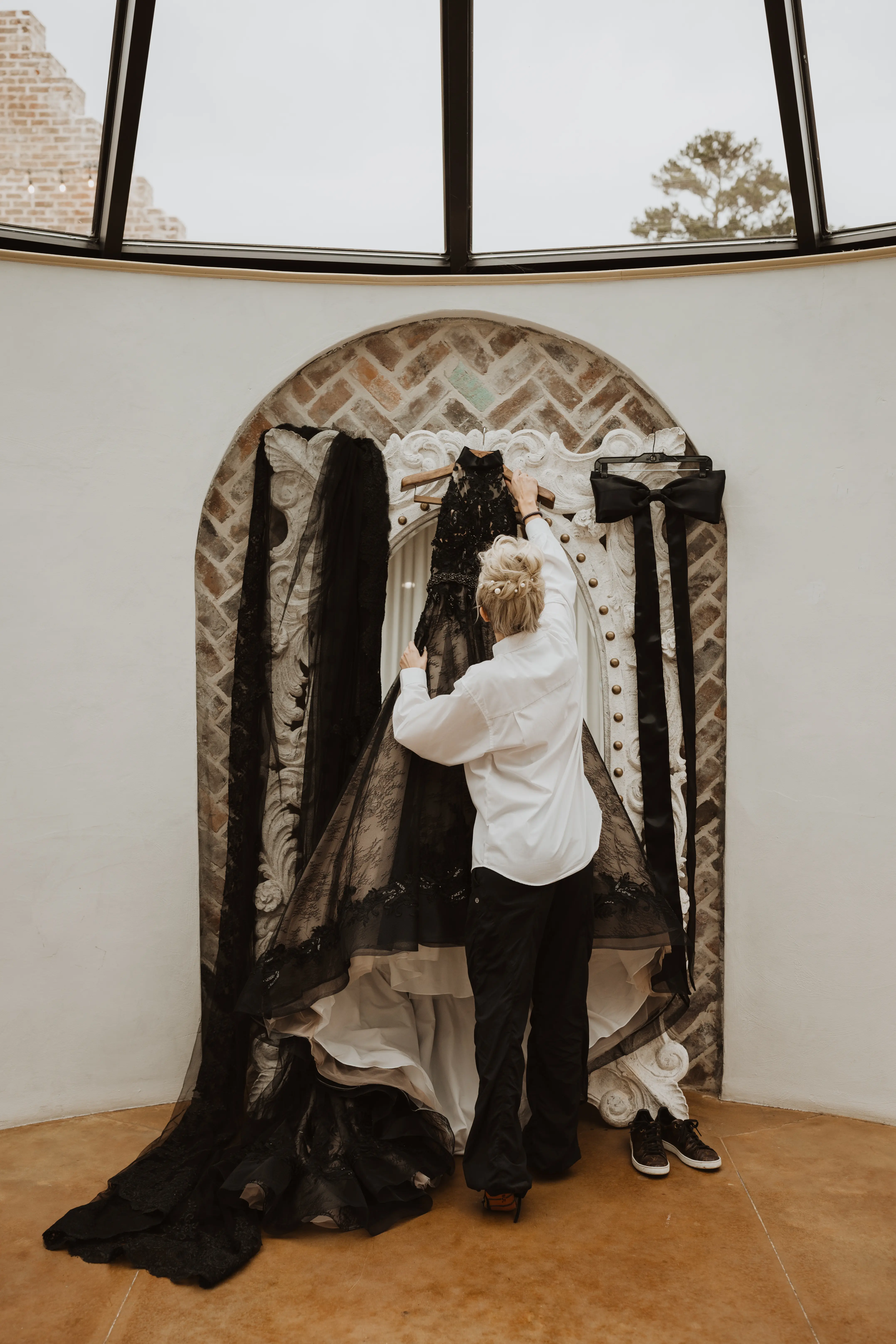 Real Bride's Beautiful Black Ball Gown Wedding Dress with Contrasting Layers of Tulle, Lace Motifs, and Chantilly Lace Called Zander by Sottero & Midgley