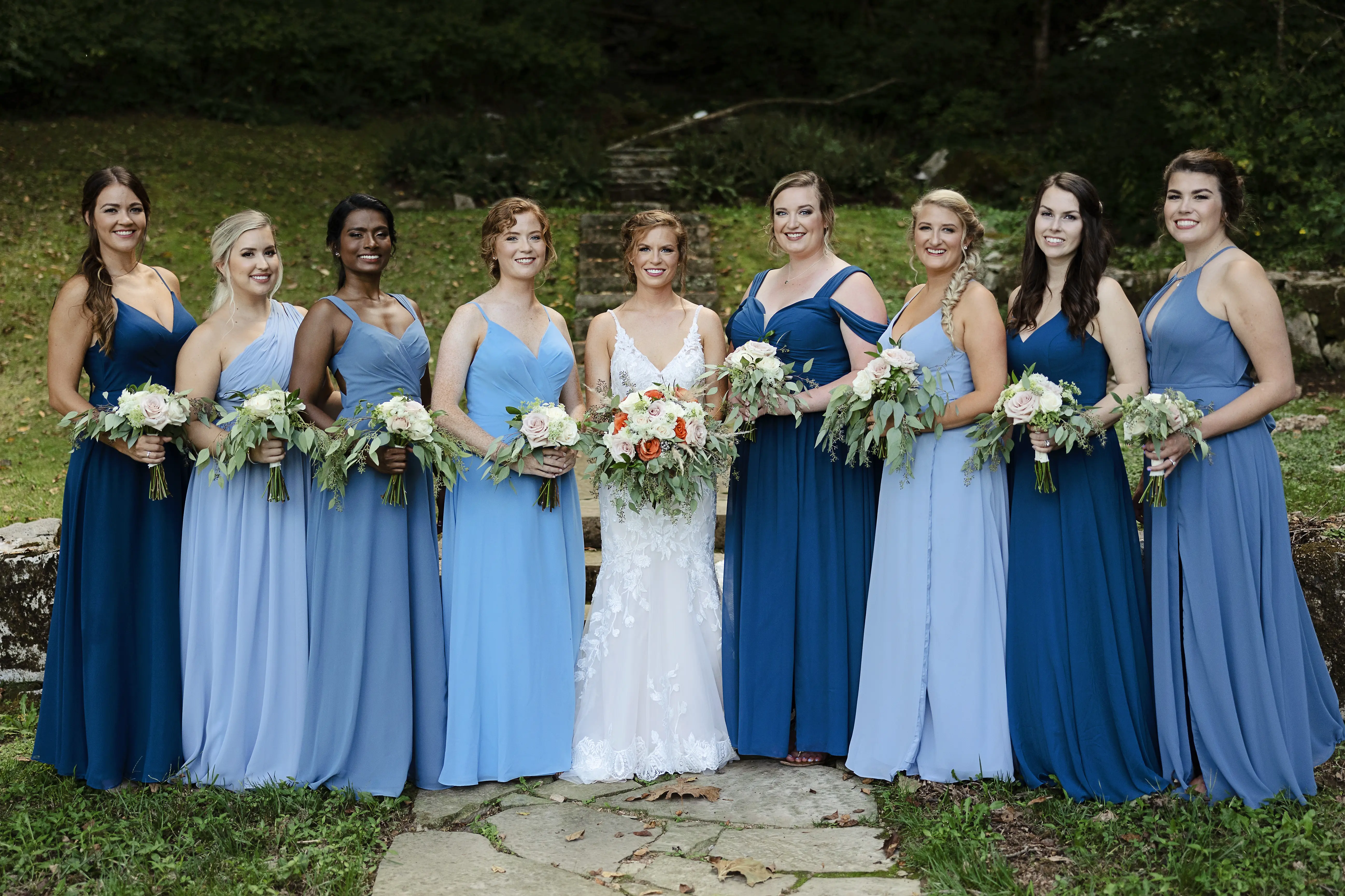 Bride In Sexy Lace Wedding Dress Called Giana By Maggie Sottero With Bridesmaids In Blue