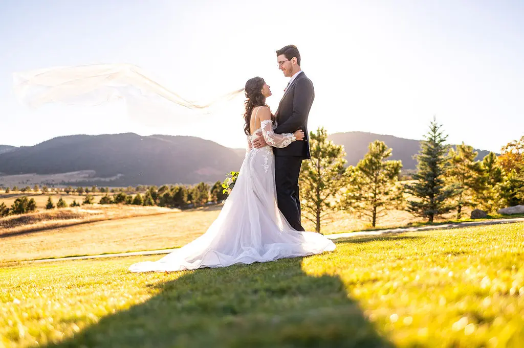 Bride with groom wearing boho A-line wedding dress