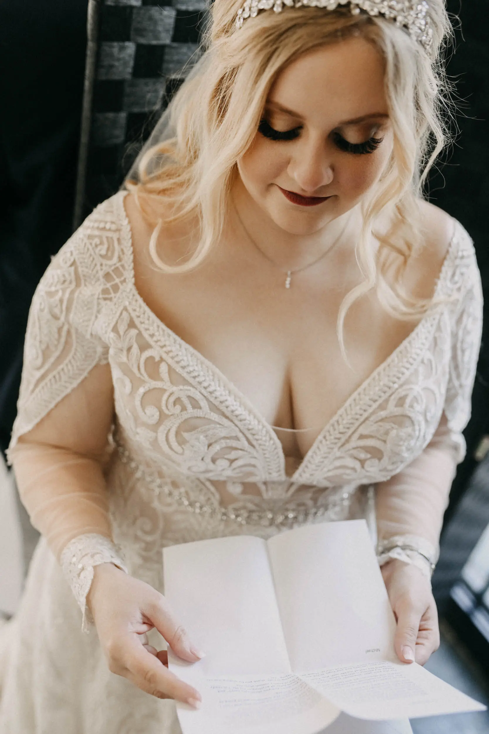 Bride reading vows looking gorgeous in wedding dress called Roxanne with customised sleeves.