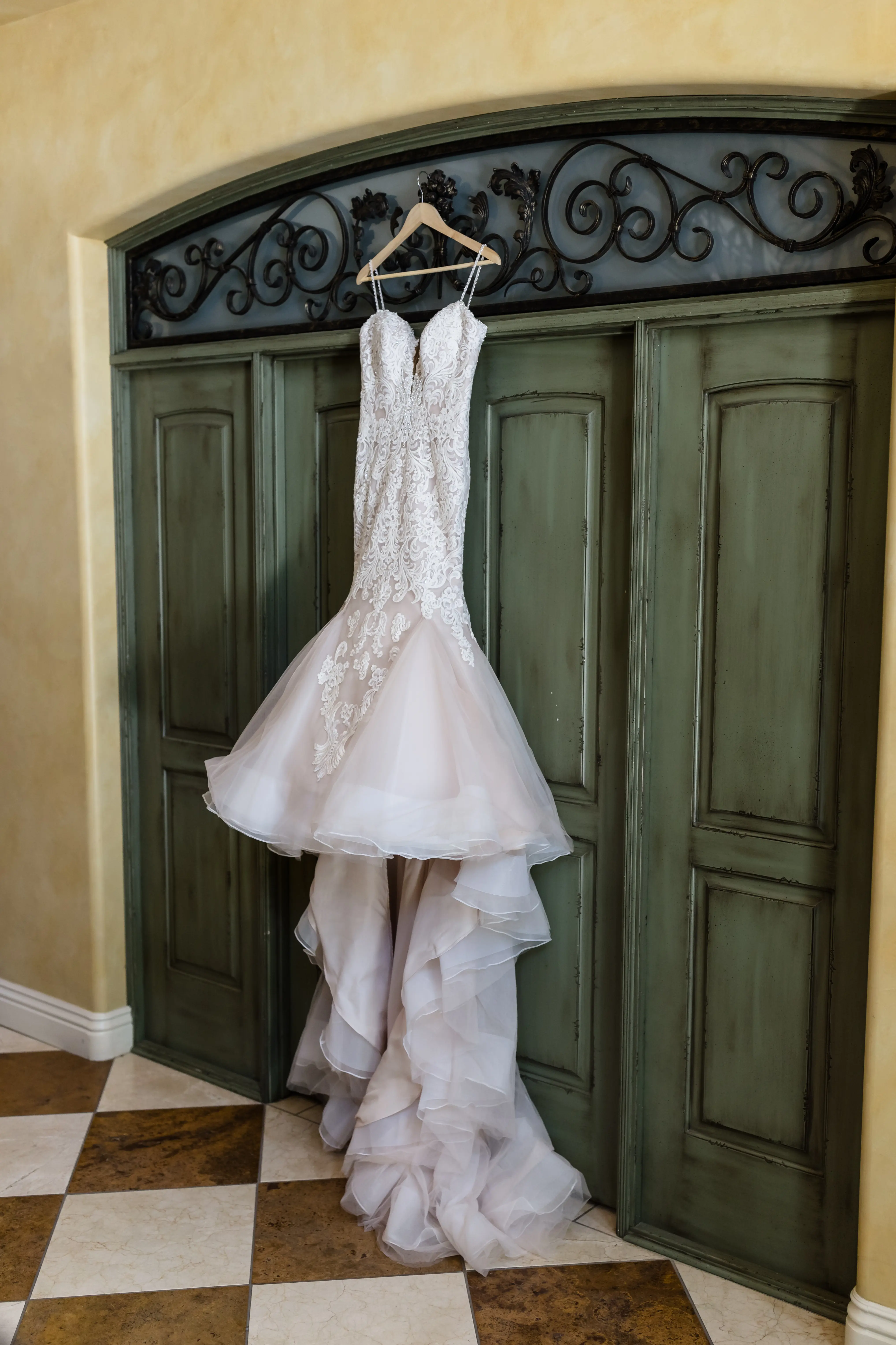 Lace Fit and Flare Wedding Dress by Maggie Sottero Dress Hanging On Door