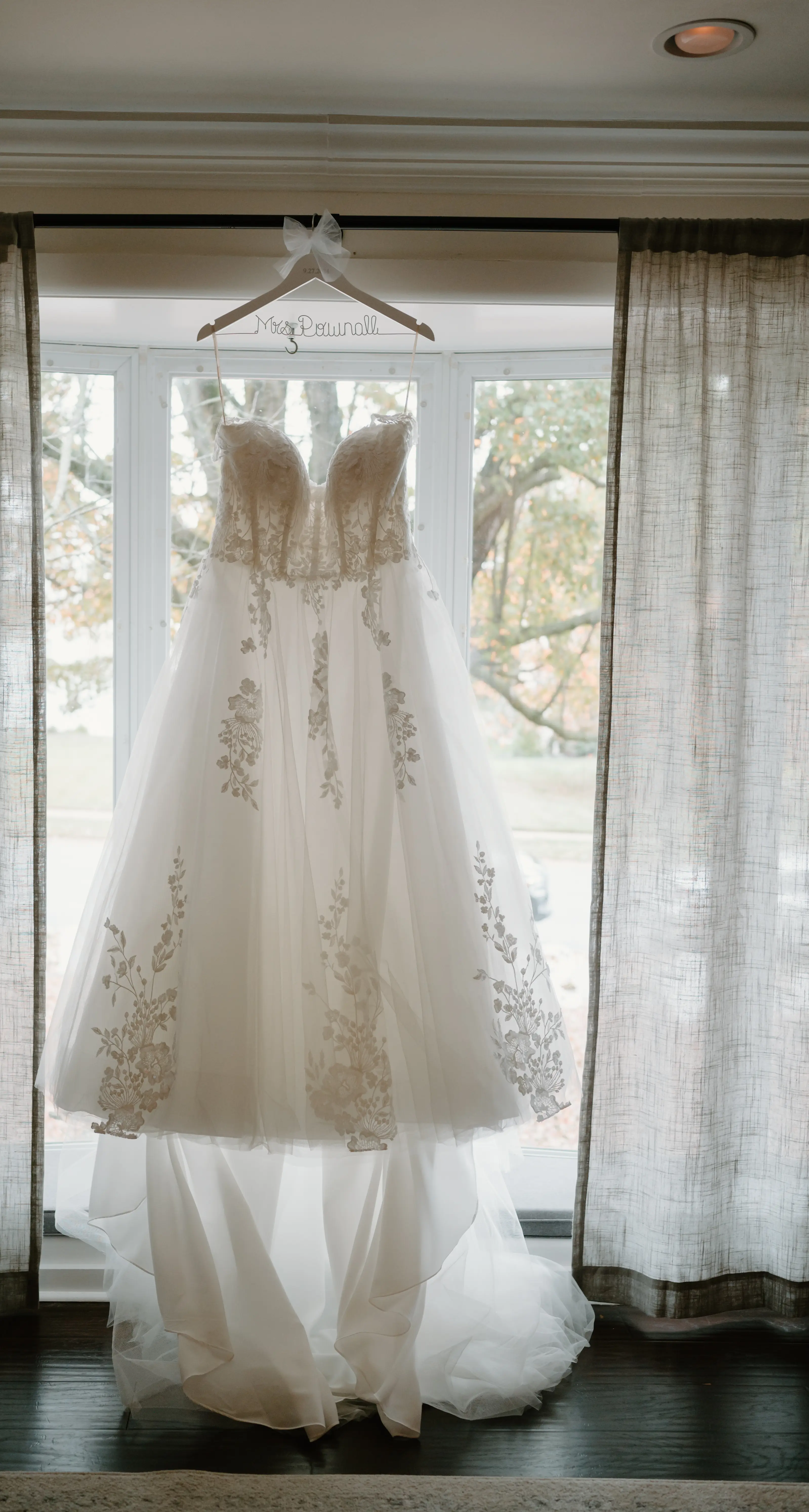 Lace Princess Dress Called Harlem By Maggie Sottero Hanging From A Window