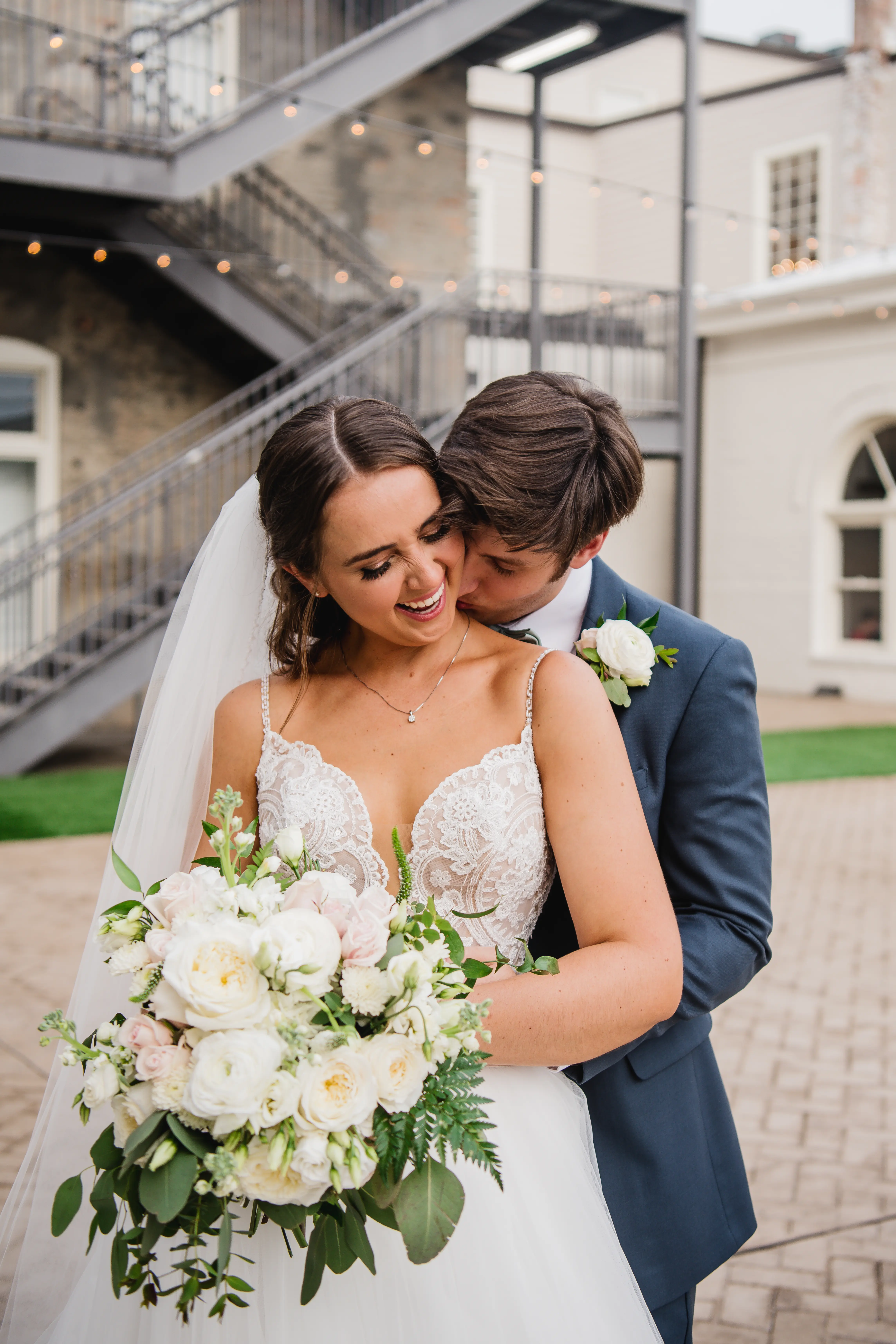Bride wearing a boho princess wedding dress in lace and tulle