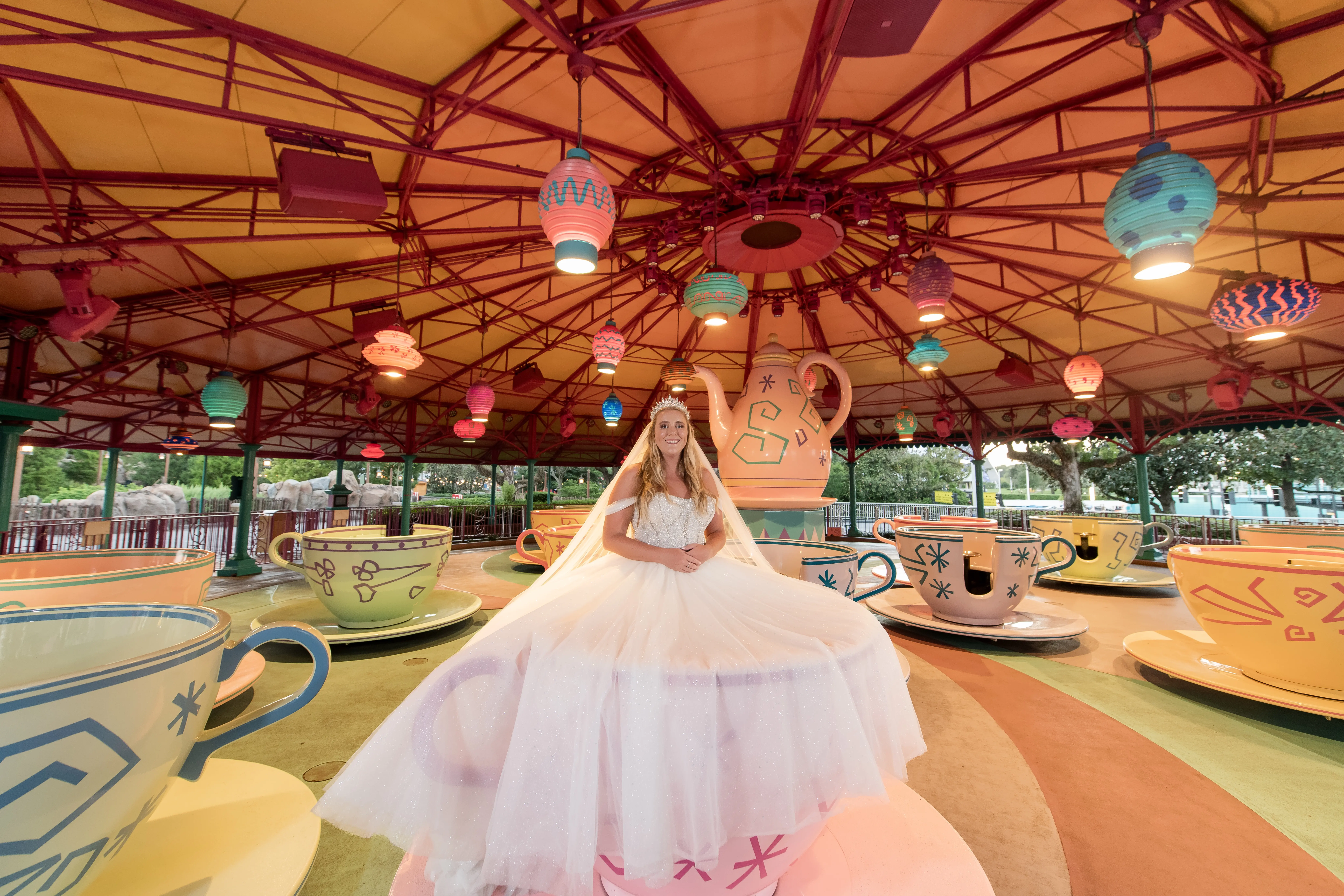Bride wearing Elton wedding dress by Sottero and Midgley on an amusement park ride